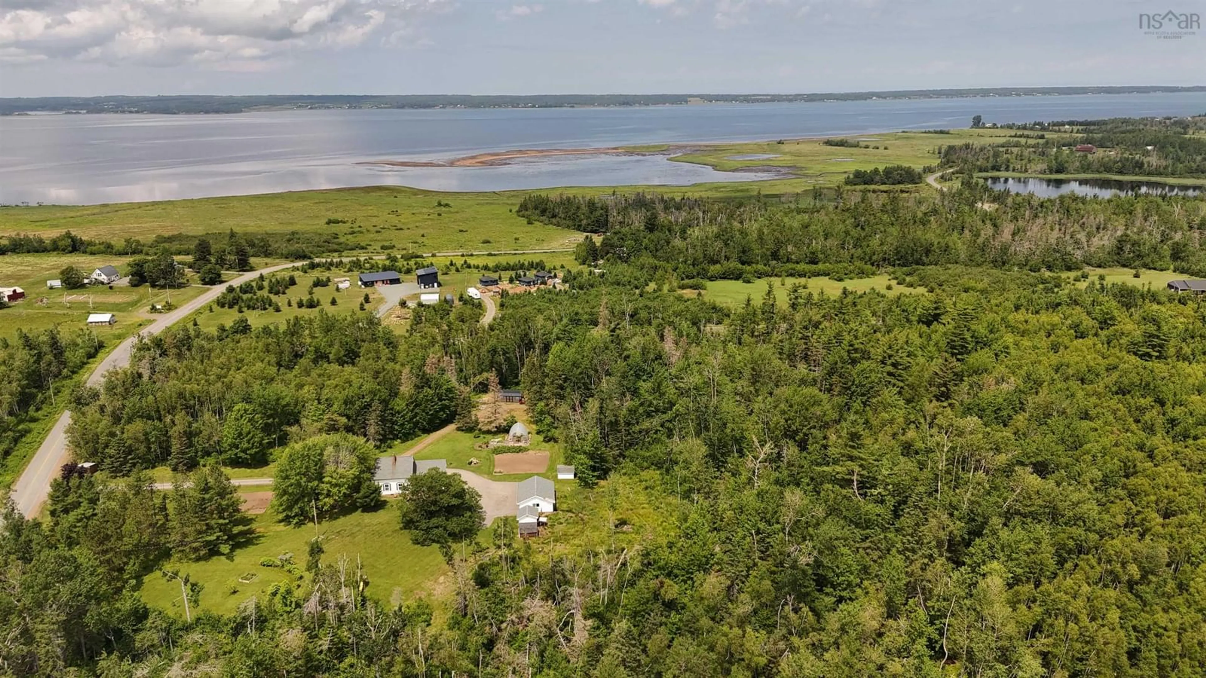 A pic from outside/outdoor area/front of a property/back of a property/a pic from drone, water/lake/river/ocean view for 510 Sand Point Rd, Barrachois Nova Scotia B0K 1V0