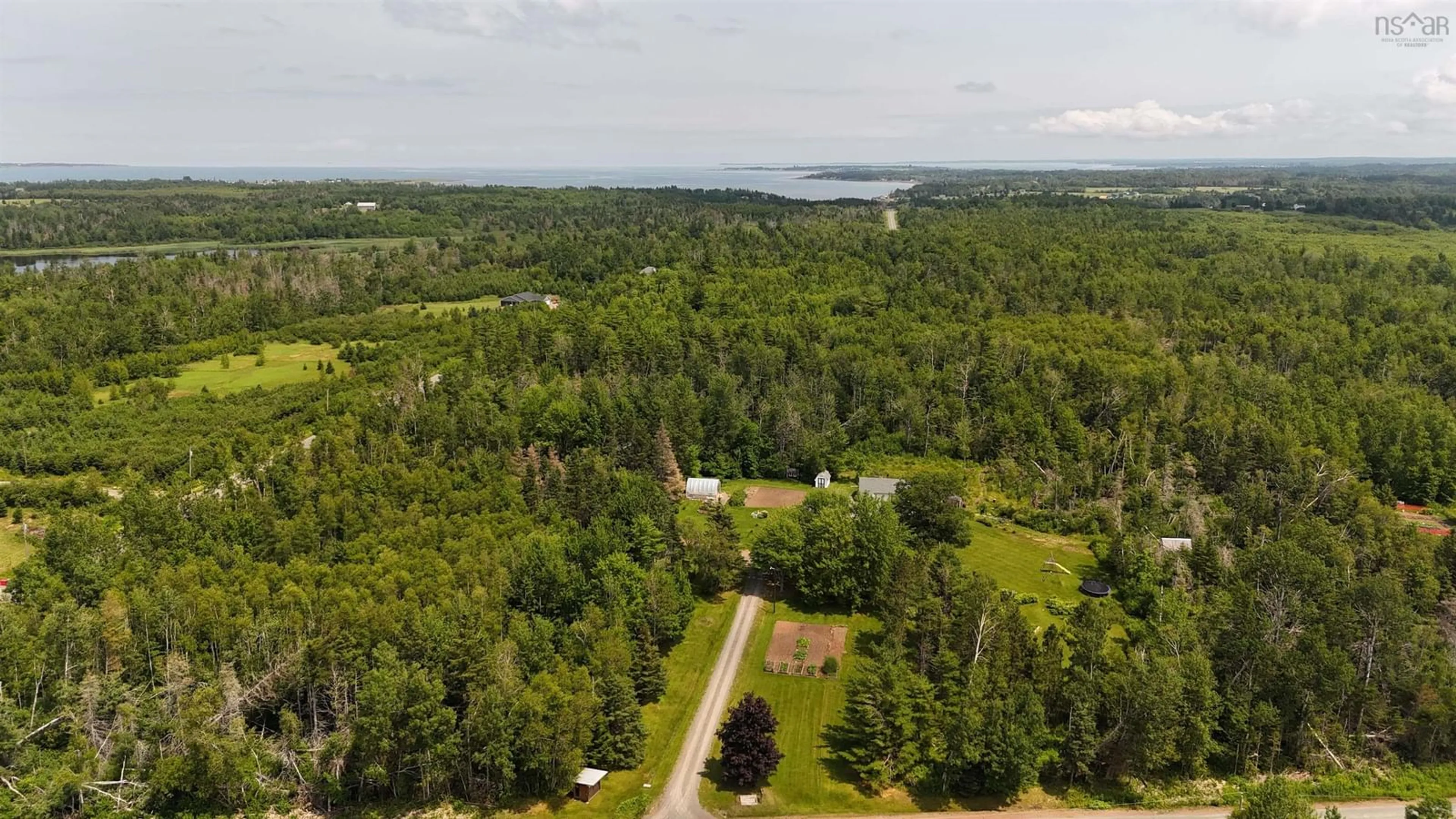 A pic from outside/outdoor area/front of a property/back of a property/a pic from drone, water/lake/river/ocean view for 510 Sand Point Rd, Barrachois Nova Scotia B0K 1V0