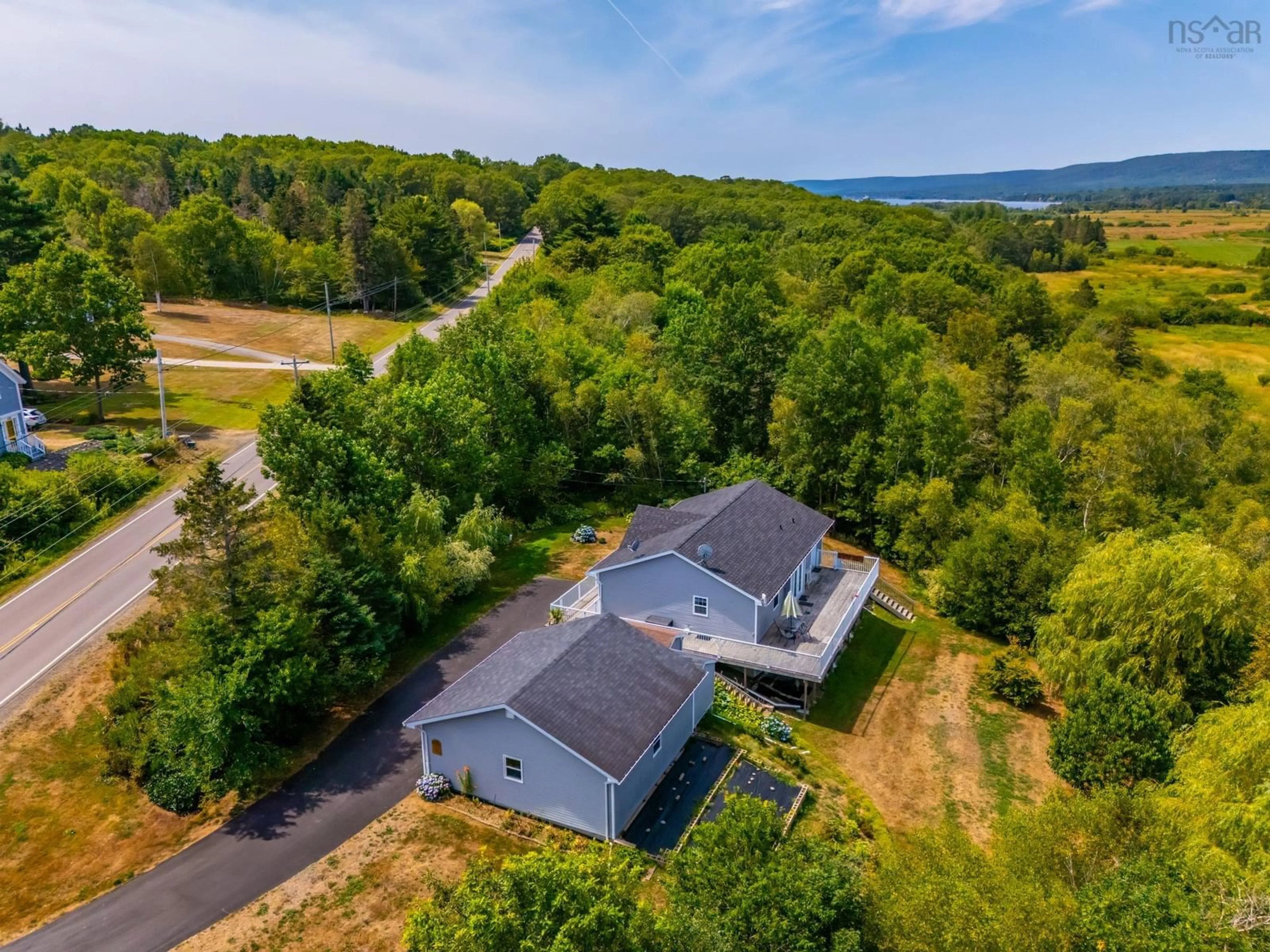 A pic from outside/outdoor area/front of a property/back of a property/a pic from drone, water/lake/river/ocean view for 1241 Highway 201, Round Hill Nova Scotia B0S 1A0