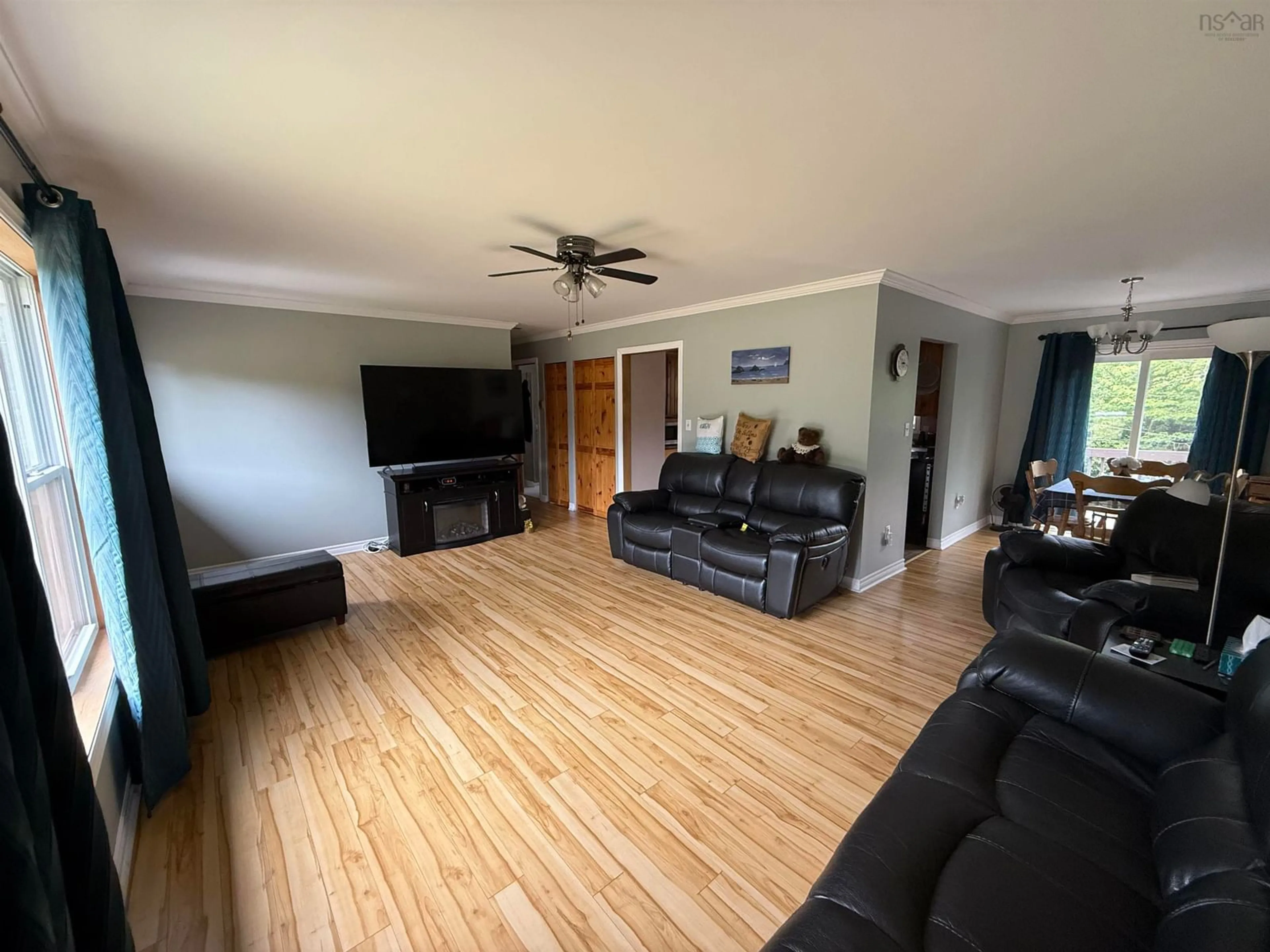 Living room with furniture, wood/laminate floor for 6536 Highway 224, Pleasant Valley Nova Scotia B0N 2M0