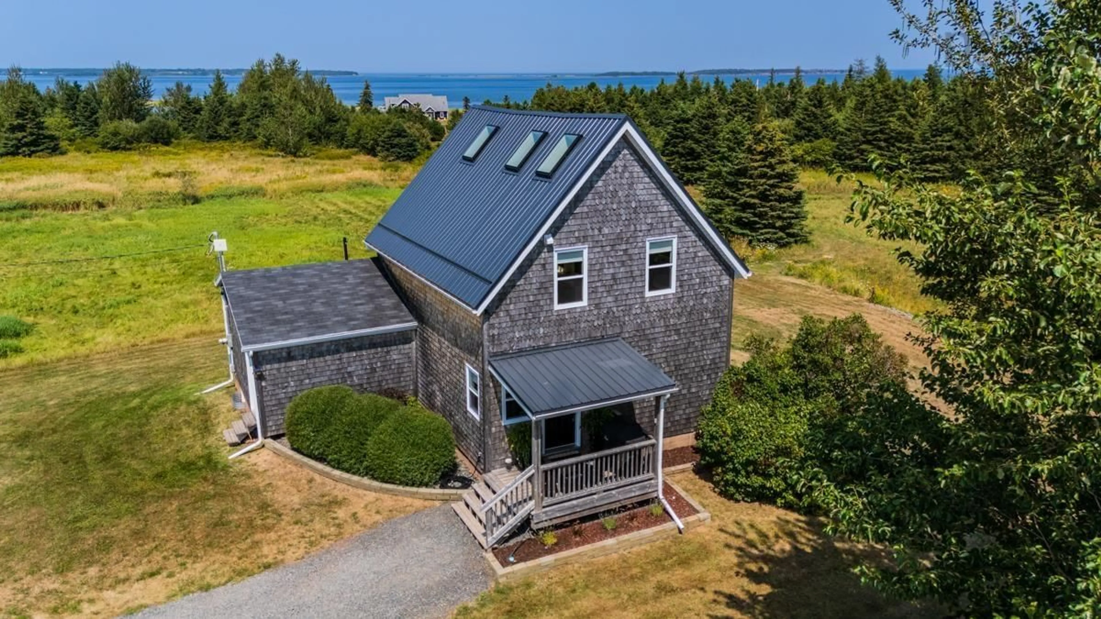 A pic from outside/outdoor area/front of a property/back of a property/a pic from drone, water/lake/river/ocean view for 6 Horton Point Rd, Malagash Nova Scotia B0K 1E0