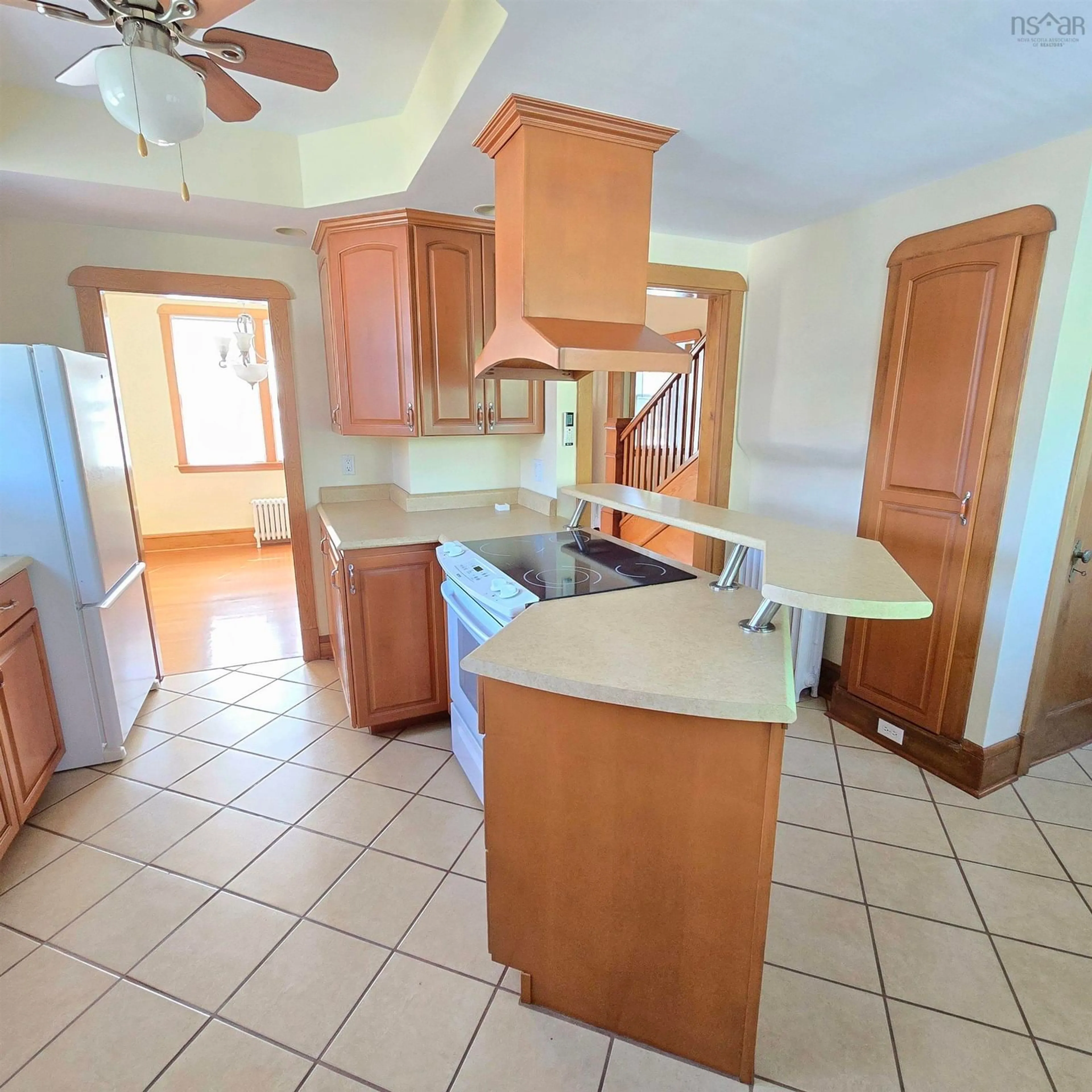 Open concept kitchen, ceramic/tile floor for 142 Shandwick St, Sydney Nova Scotia B1P 4V6