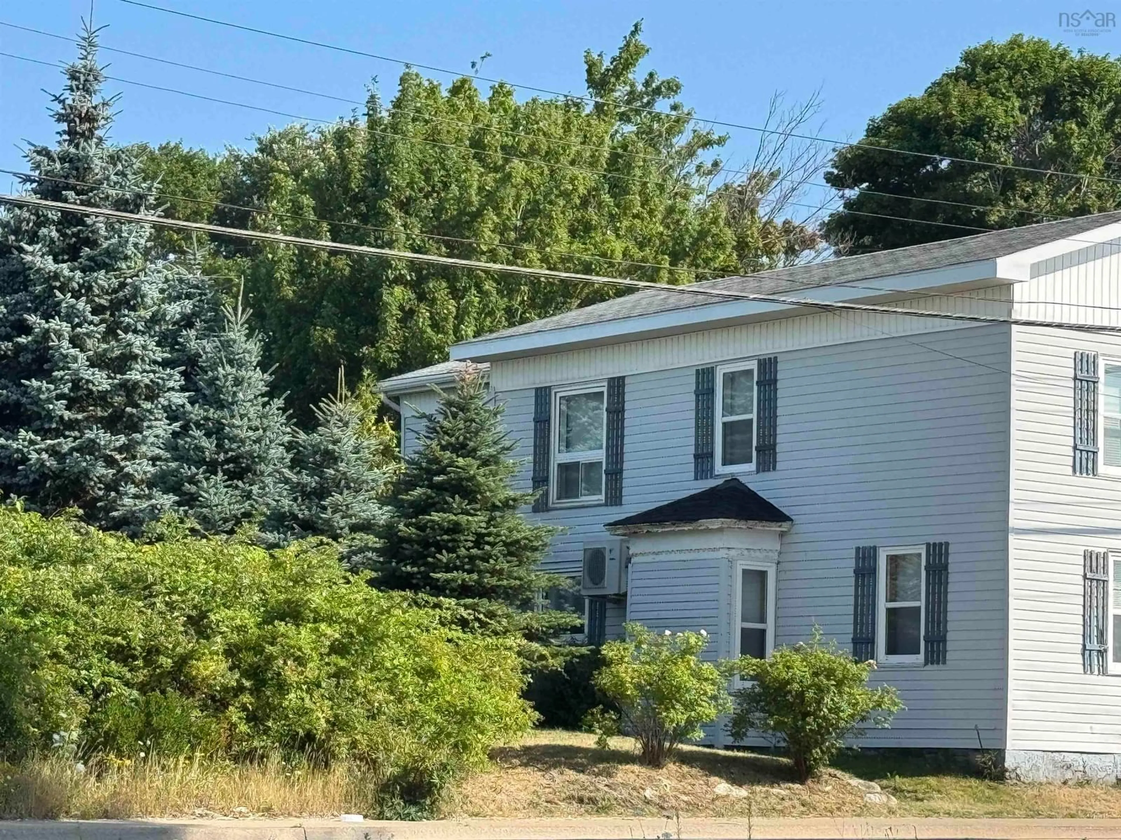 Home with vinyl exterior material, street for 402 Purves St, North Sydney Nova Scotia B2A 1C6