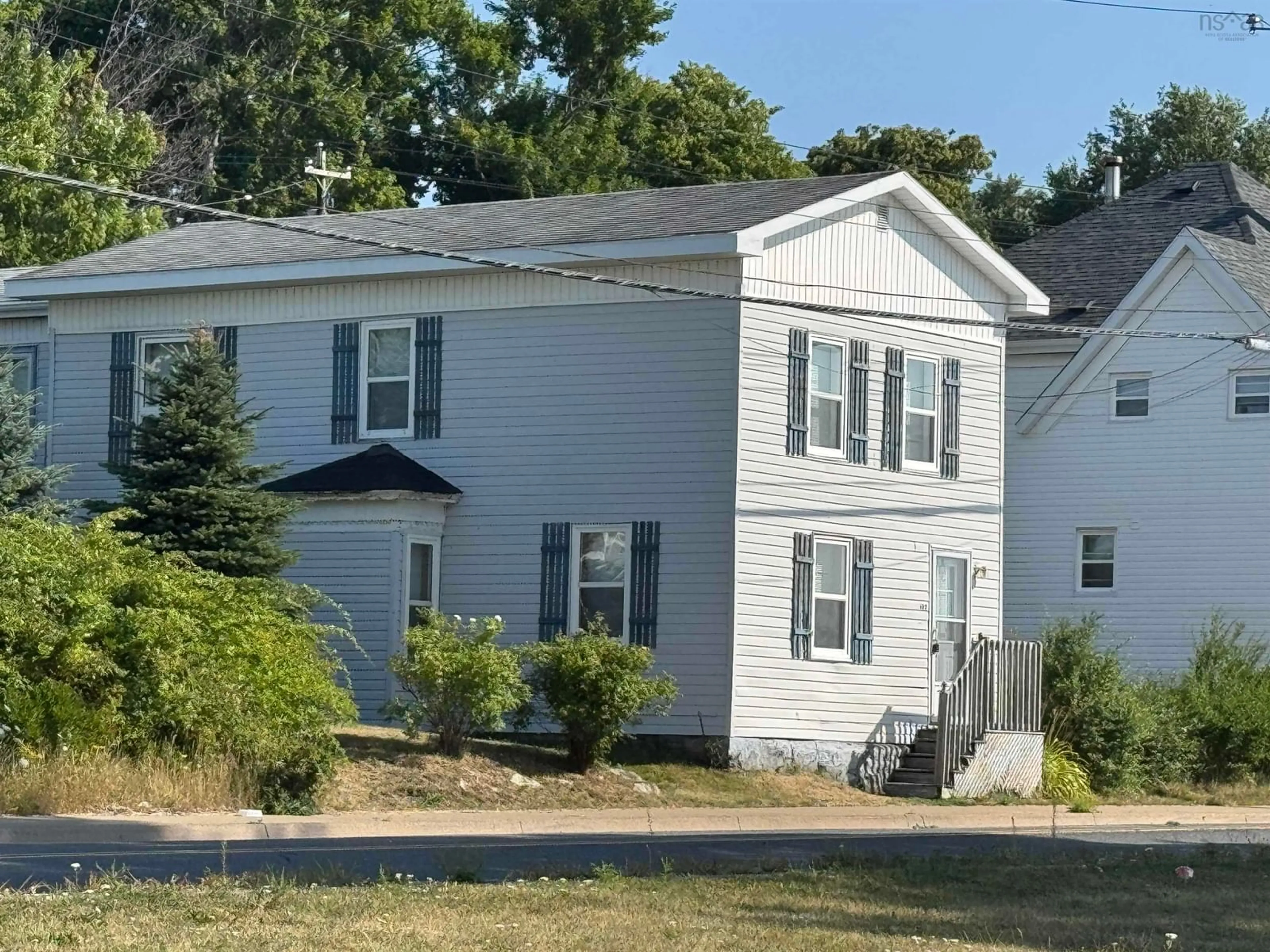 Home with vinyl exterior material, street for 402 Purves St, North Sydney Nova Scotia B2A 1C6