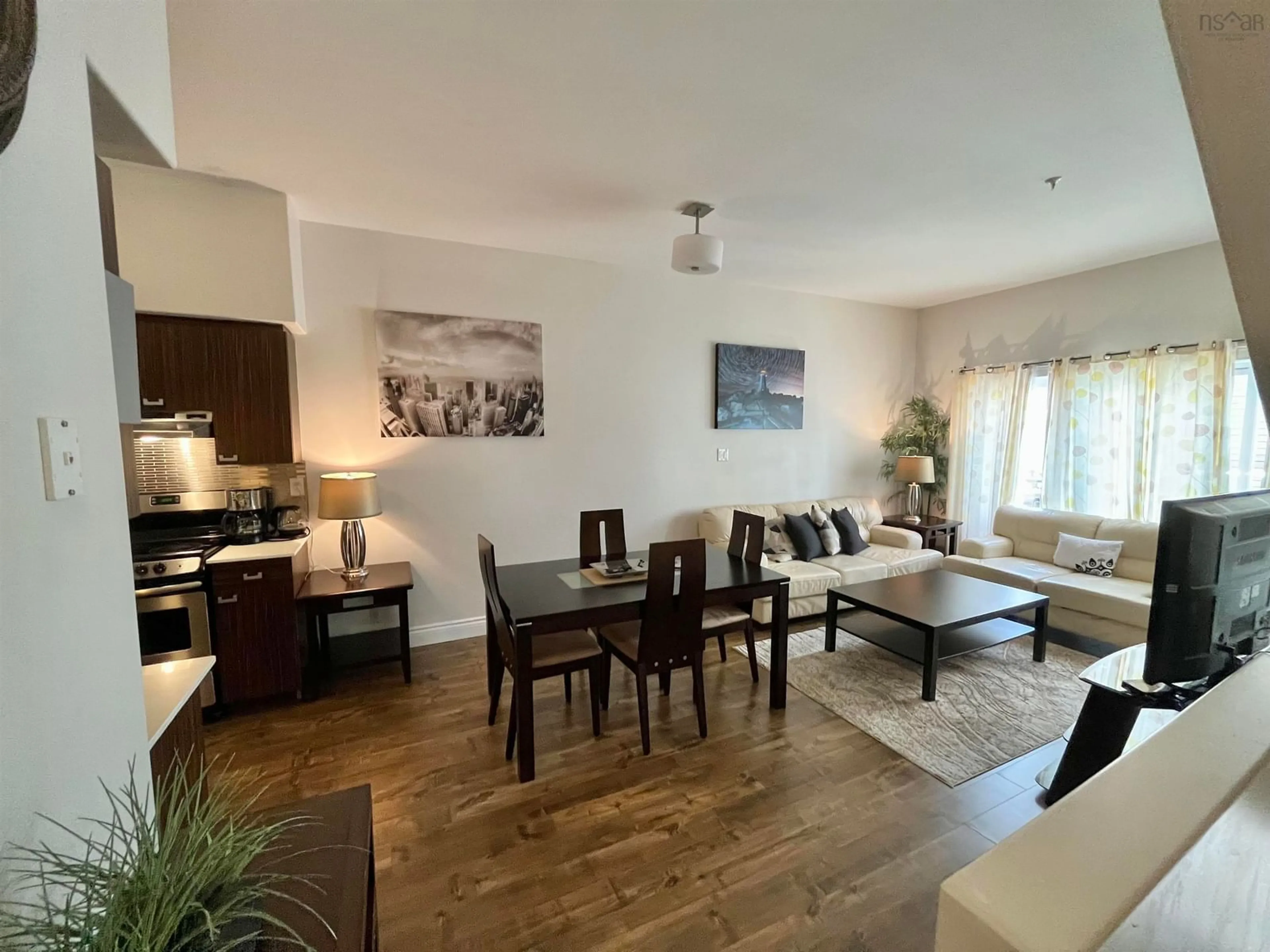 Living room with furniture, wood/laminate floor for 305 - 2116 Gottingen St, Halifax Nova Scotia B3K 0C5