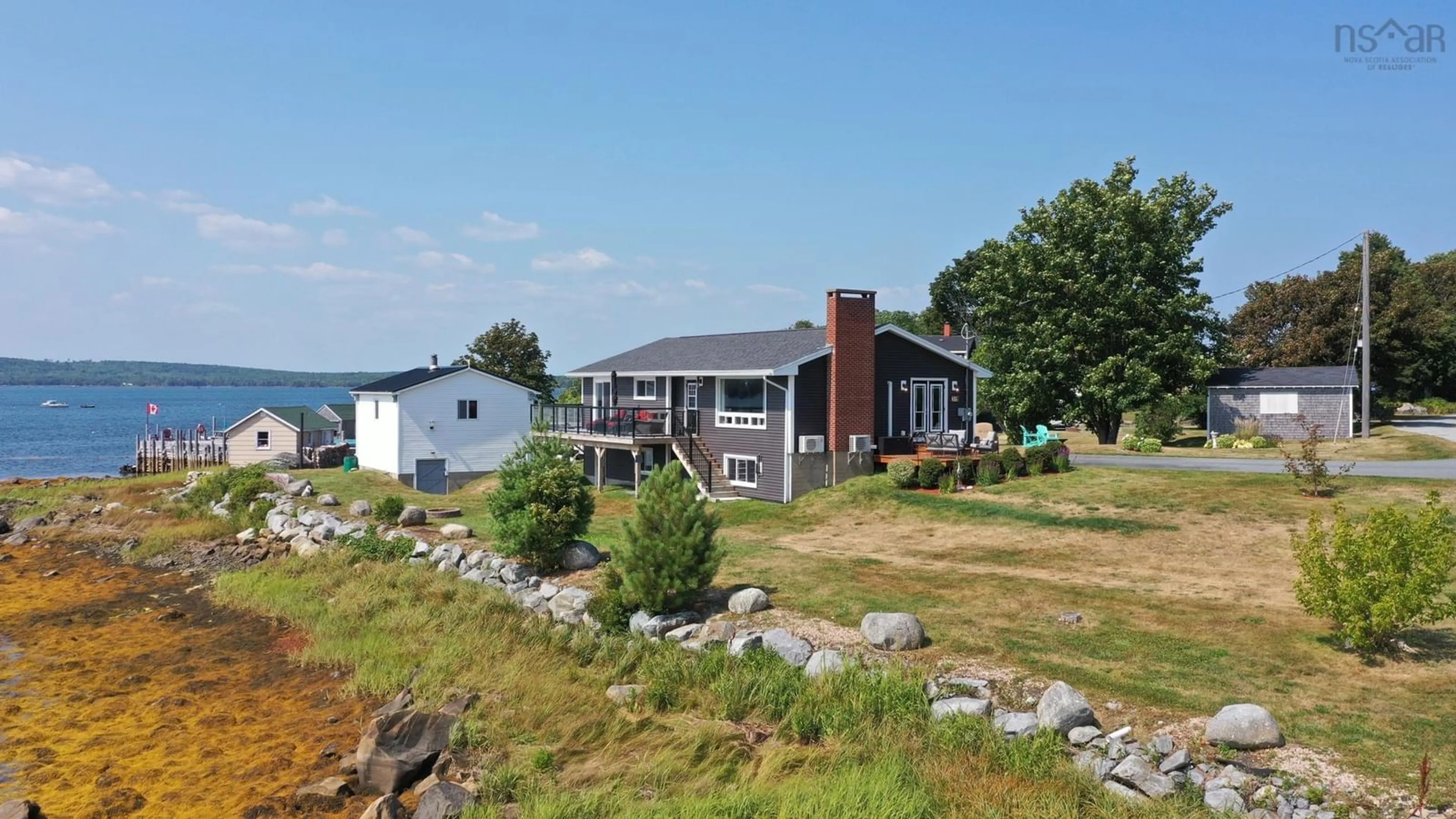 A pic from outside/outdoor area/front of a property/back of a property/a pic from drone, water/lake/river/ocean view for 31 Medway St, Port Medway Nova Scotia B0J 2T0