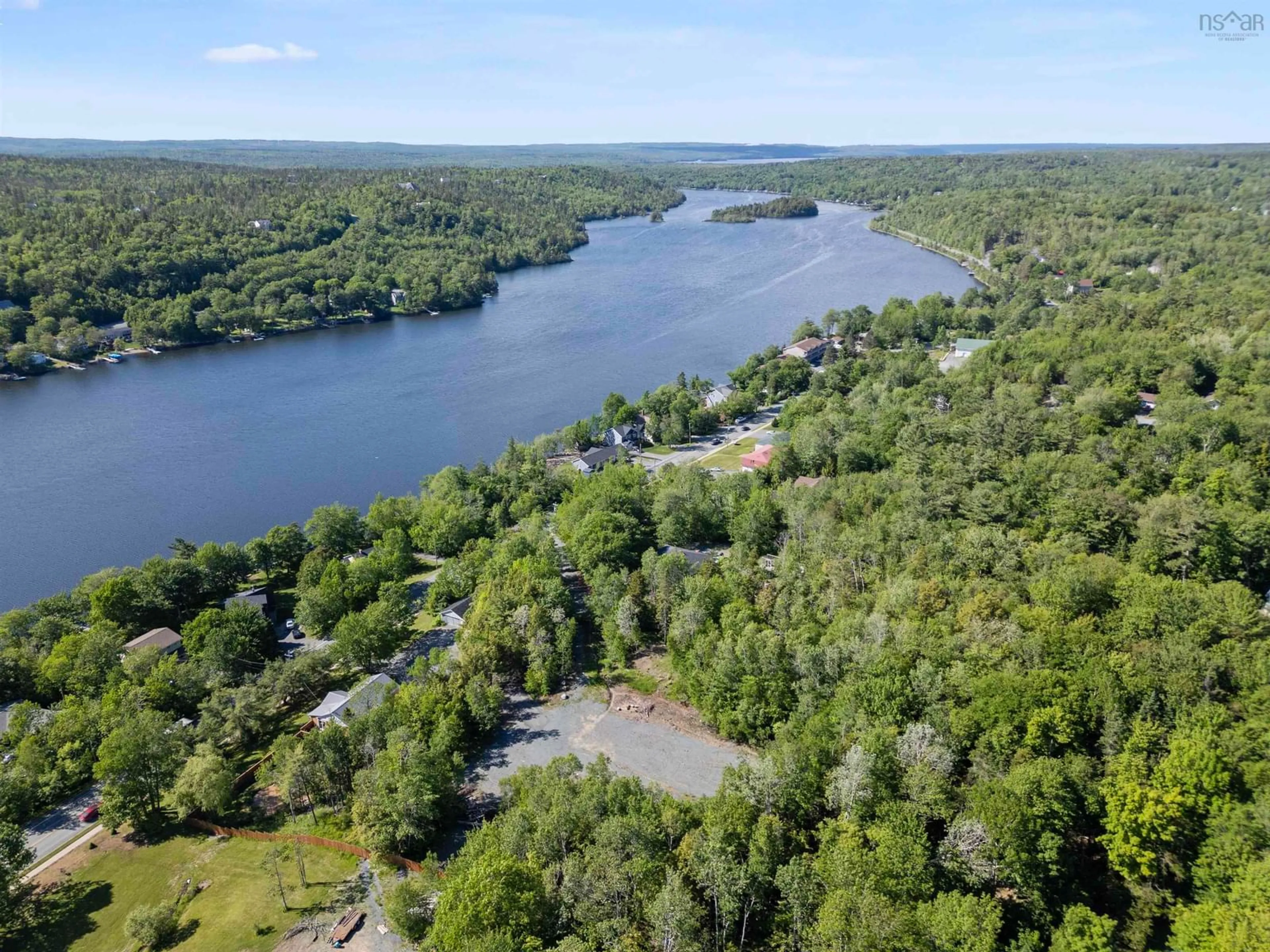 A pic from outside/outdoor area/front of a property/back of a property/a pic from drone, water/lake/river/ocean view for 3650 Highway 2 Hwy, Fletchers Lake Nova Scotia B2T 1H7