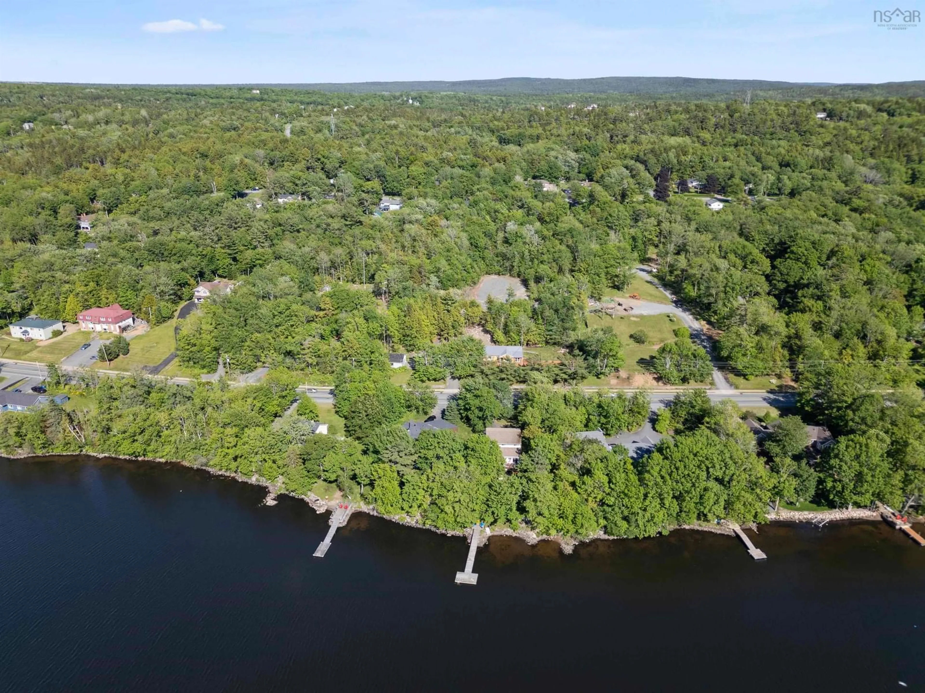 A pic from outside/outdoor area/front of a property/back of a property/a pic from drone, water/lake/river/ocean view for 3650 Highway 2 Hwy, Fletchers Lake Nova Scotia B2T 1H7