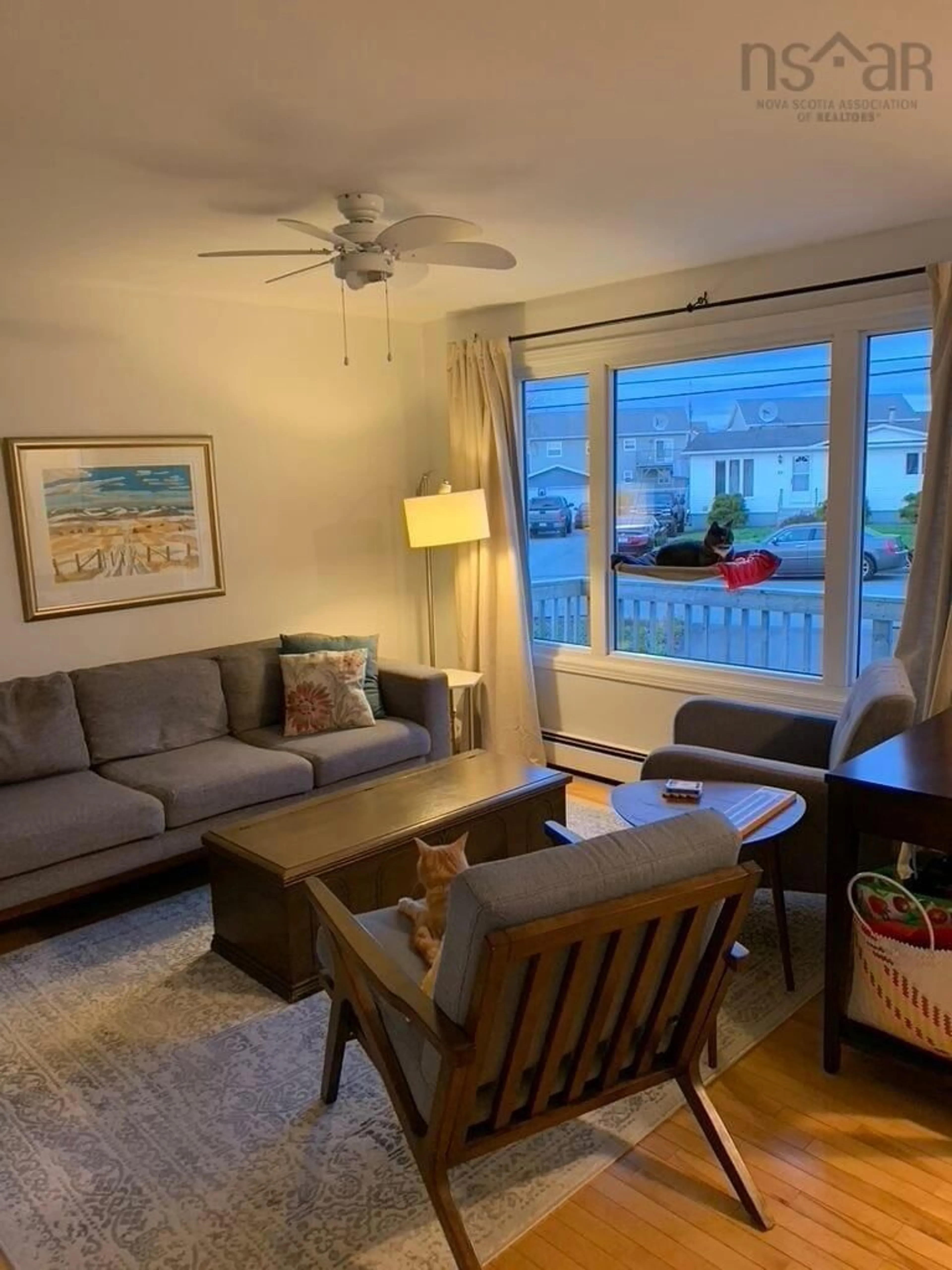 Living room with furniture, wood/laminate floor for 83 Redoubt Way, Eastern Passage Nova Scotia B3G 1E7
