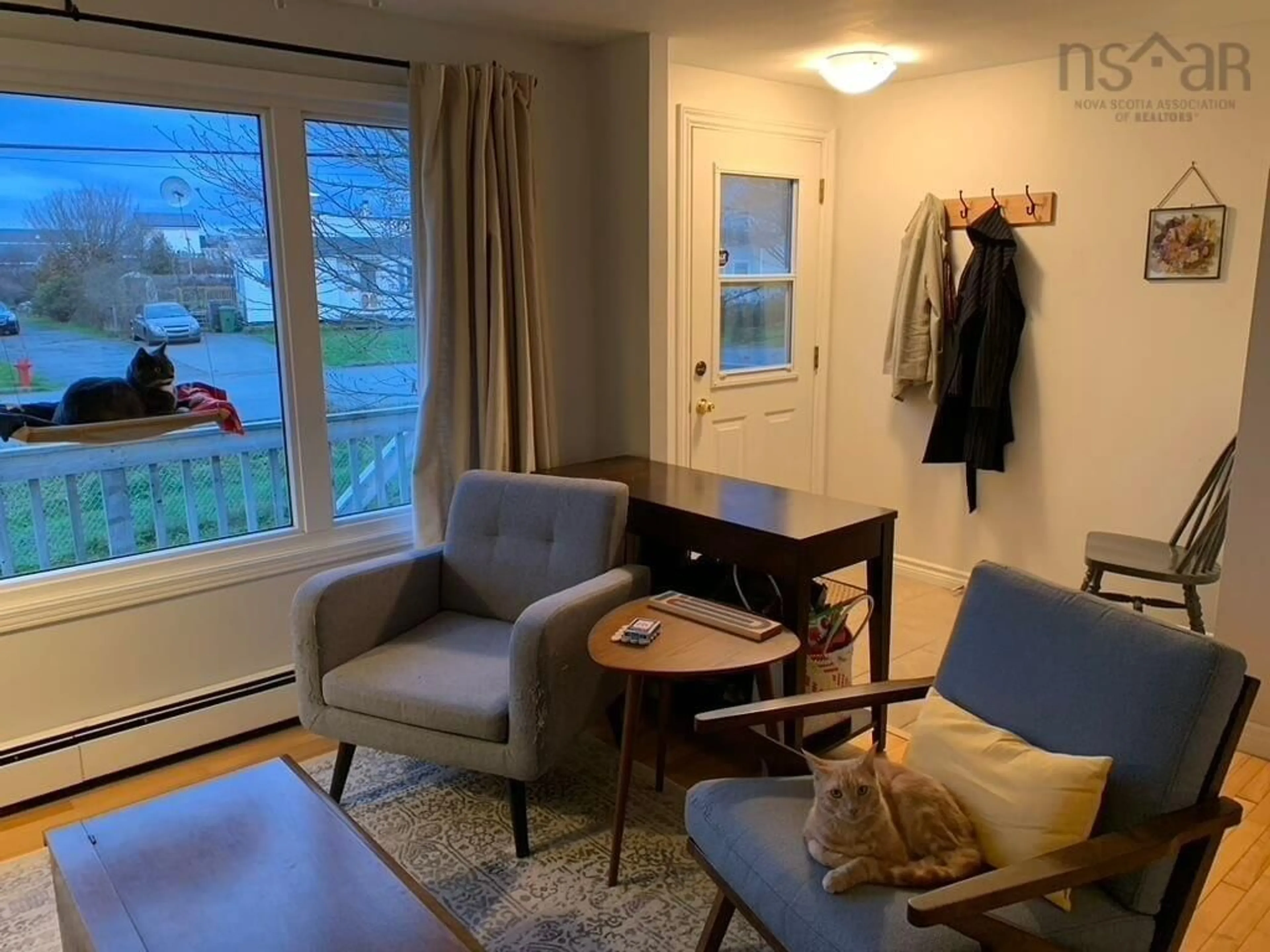 Living room with furniture, wood/laminate floor for 83 Redoubt Way, Eastern Passage Nova Scotia B3G 1E7