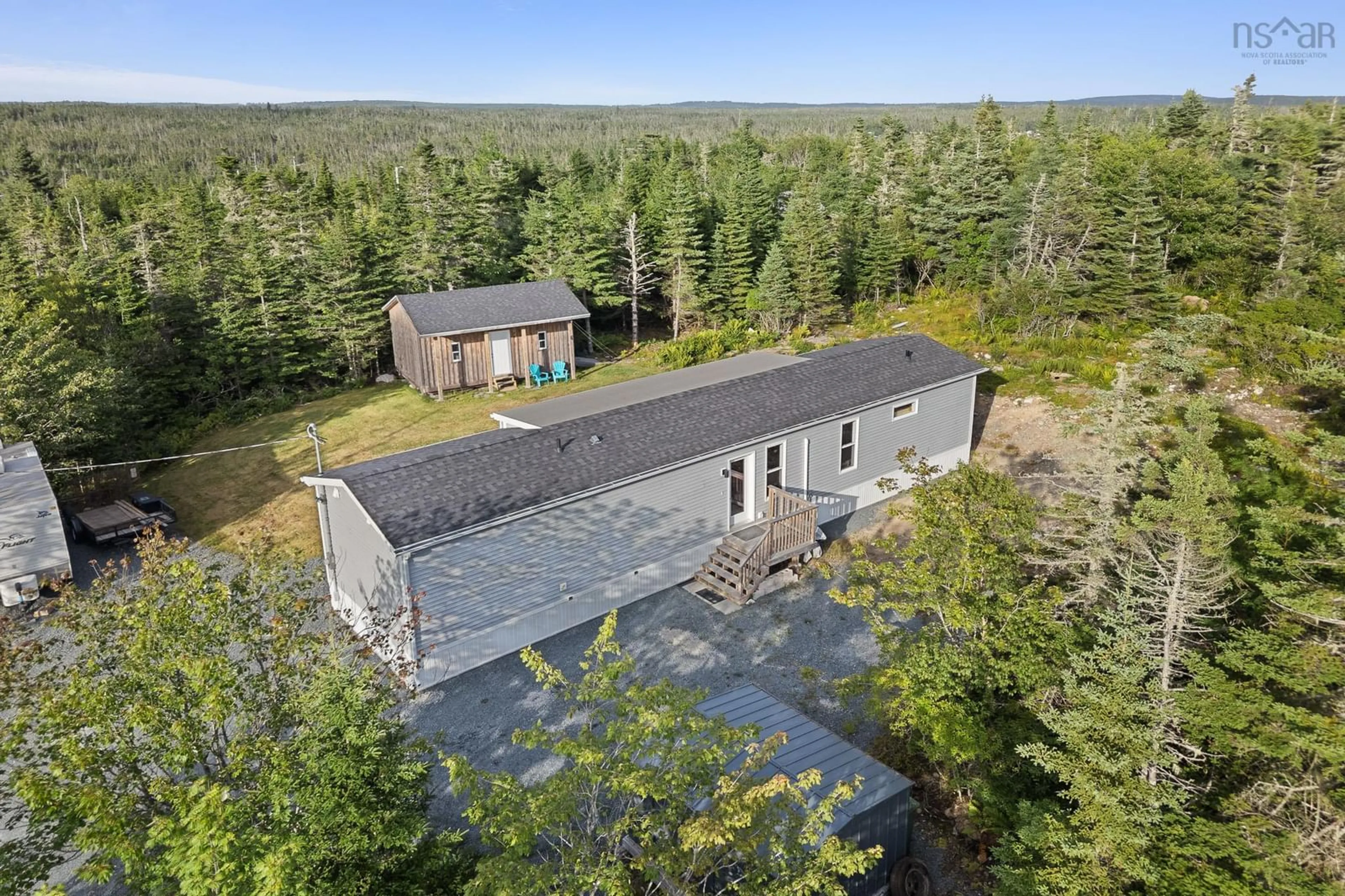A pic from outside/outdoor area/front of a property/back of a property/a pic from drone, forest/trees view for 8 Nebooktook Walk, Clam Bay Nova Scotia B0J 2L0