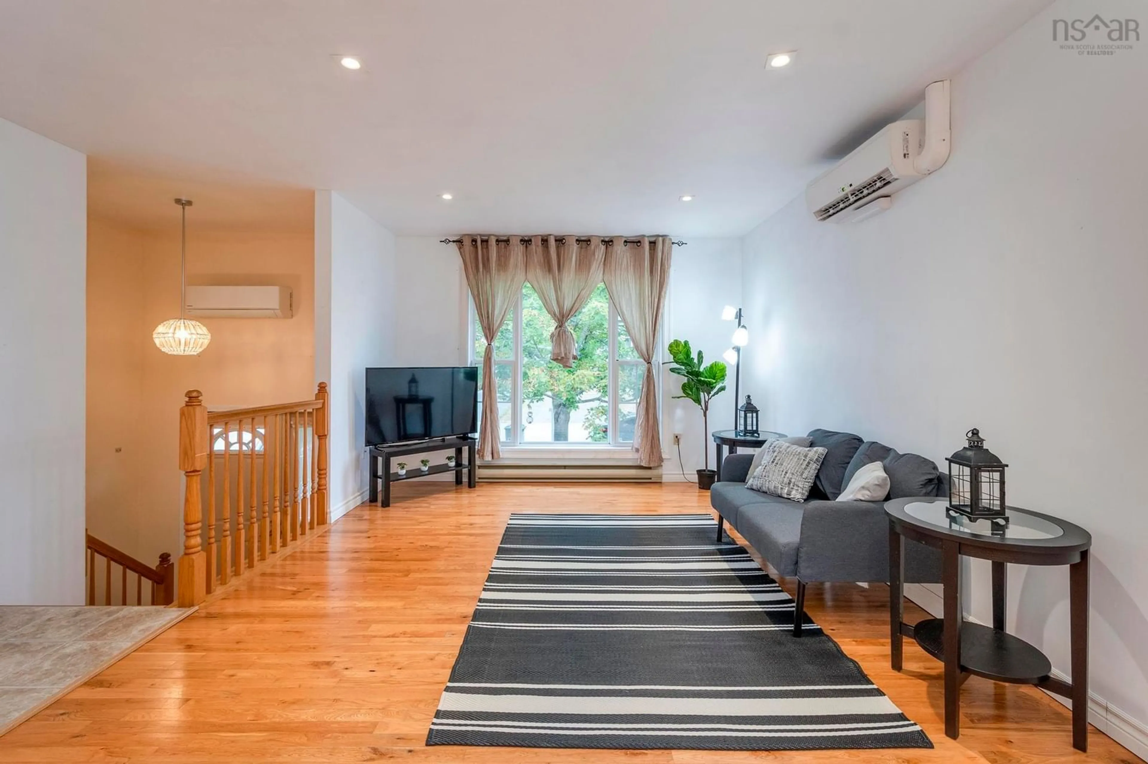 Living room with furniture, wood/laminate floor for 45 Florence Place Crt, Lower Sackville Nova Scotia B4C 3Z4