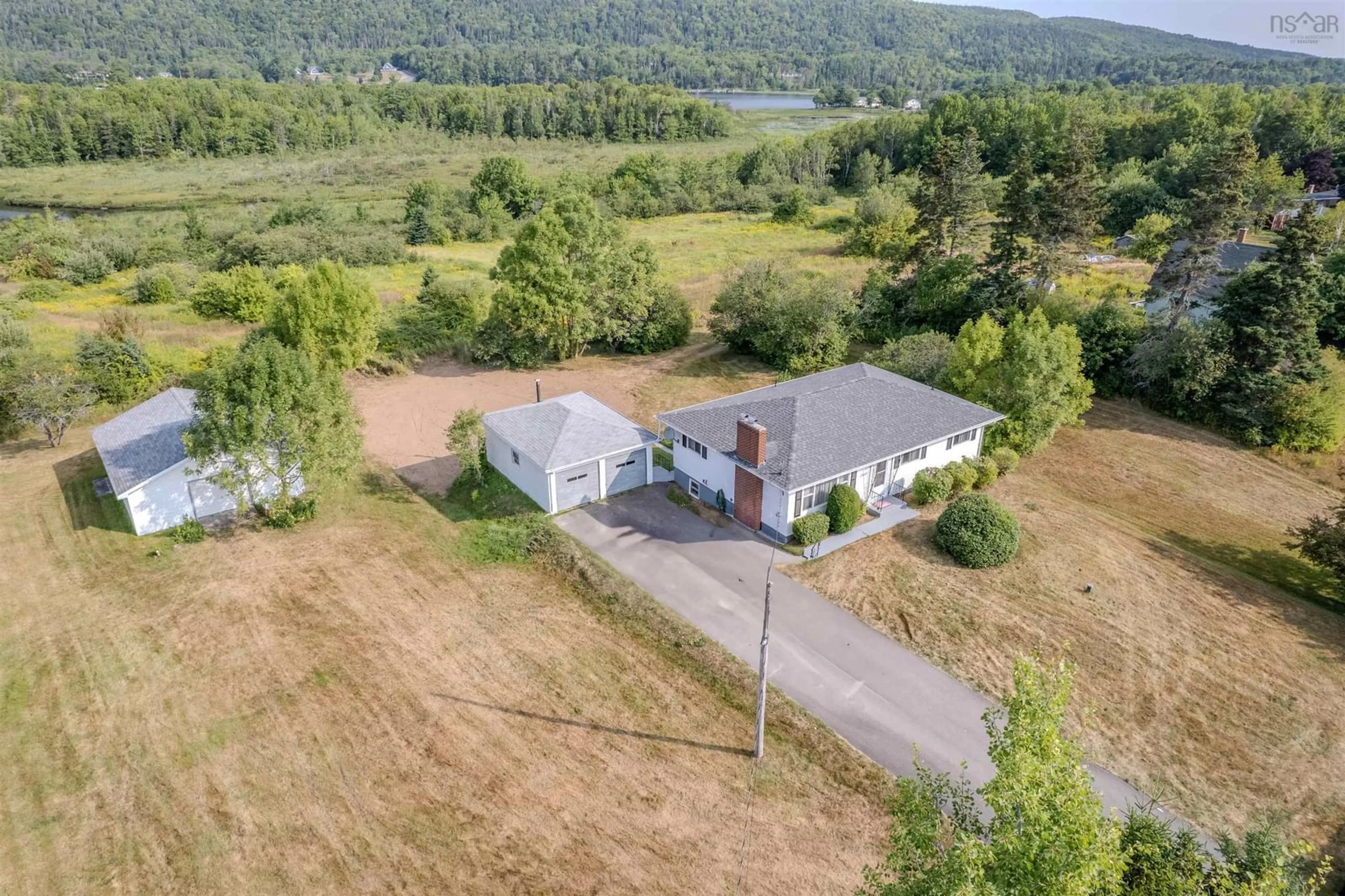 A pic from outside/outdoor area/front of a property/back of a property/a pic from drone, building for 2450 Kings Rd, Sydney Forks Nova Scotia B1L 1A1