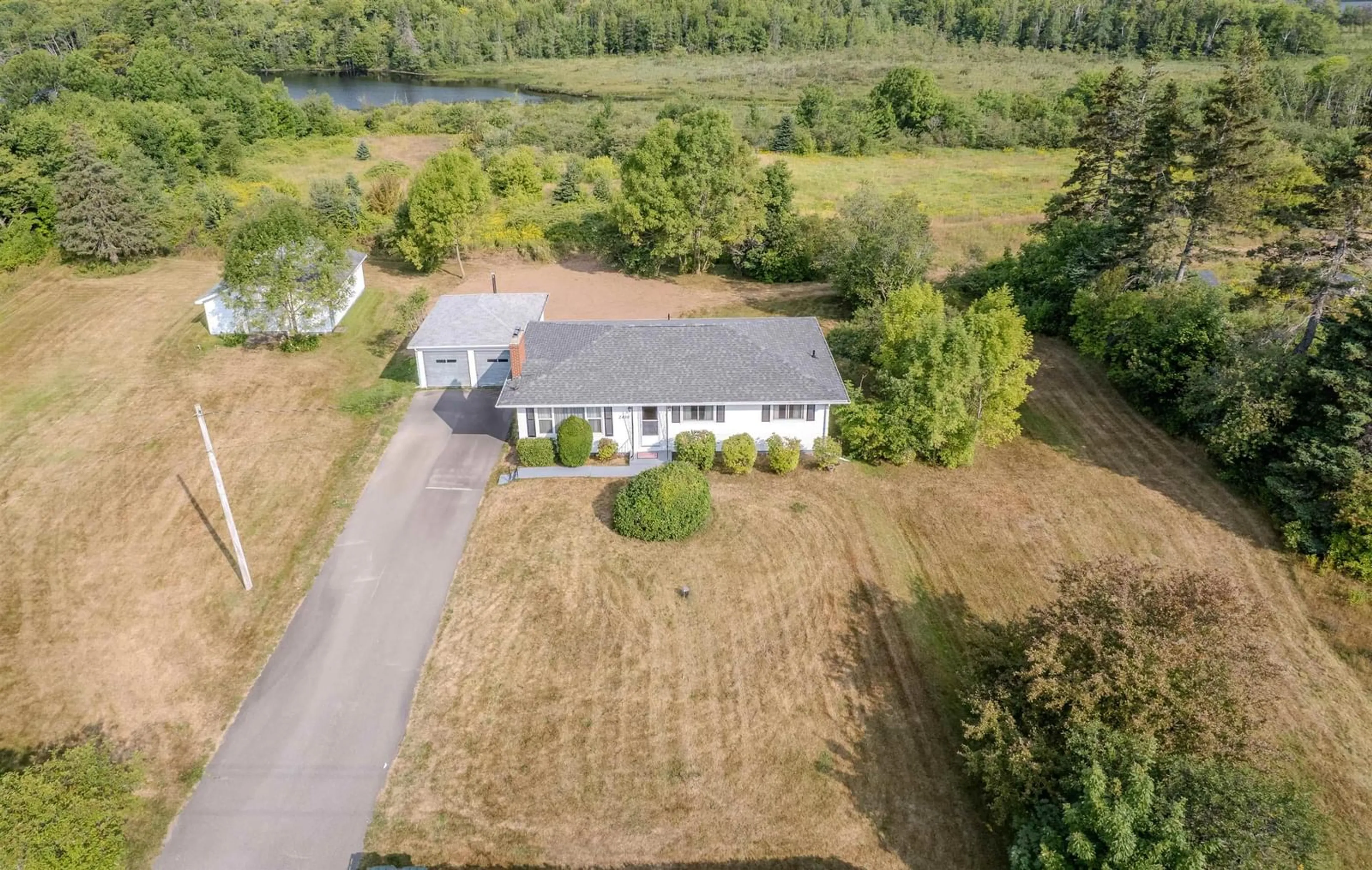 A pic from outside/outdoor area/front of a property/back of a property/a pic from drone, water/lake/river/ocean view for 2450 Kings Rd, Sydney Forks Nova Scotia B1L 1A1