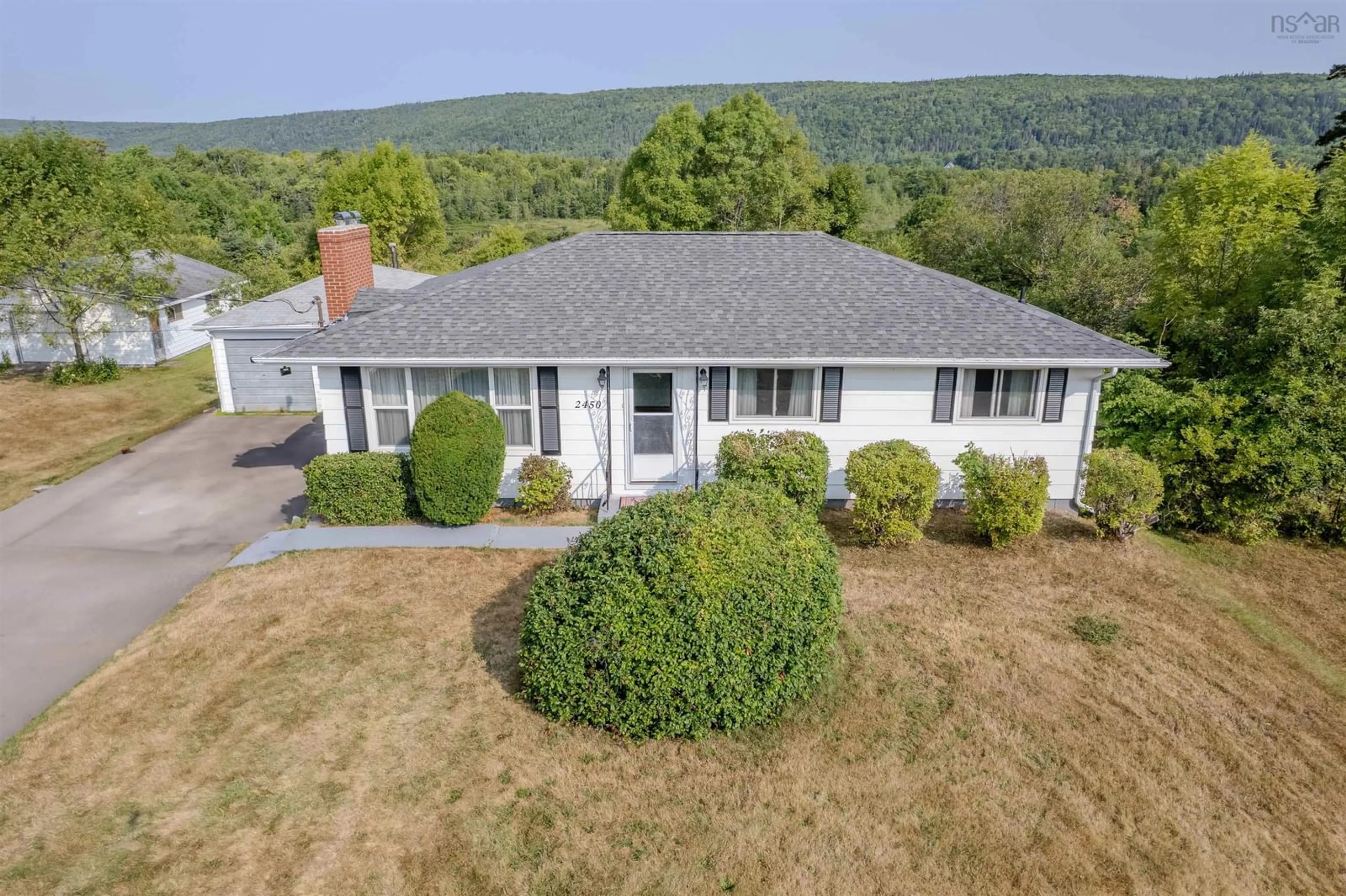 A pic from outside/outdoor area/front of a property/back of a property/a pic from drone, mountain view for 2450 Kings Rd, Sydney Forks Nova Scotia B1L 1A1