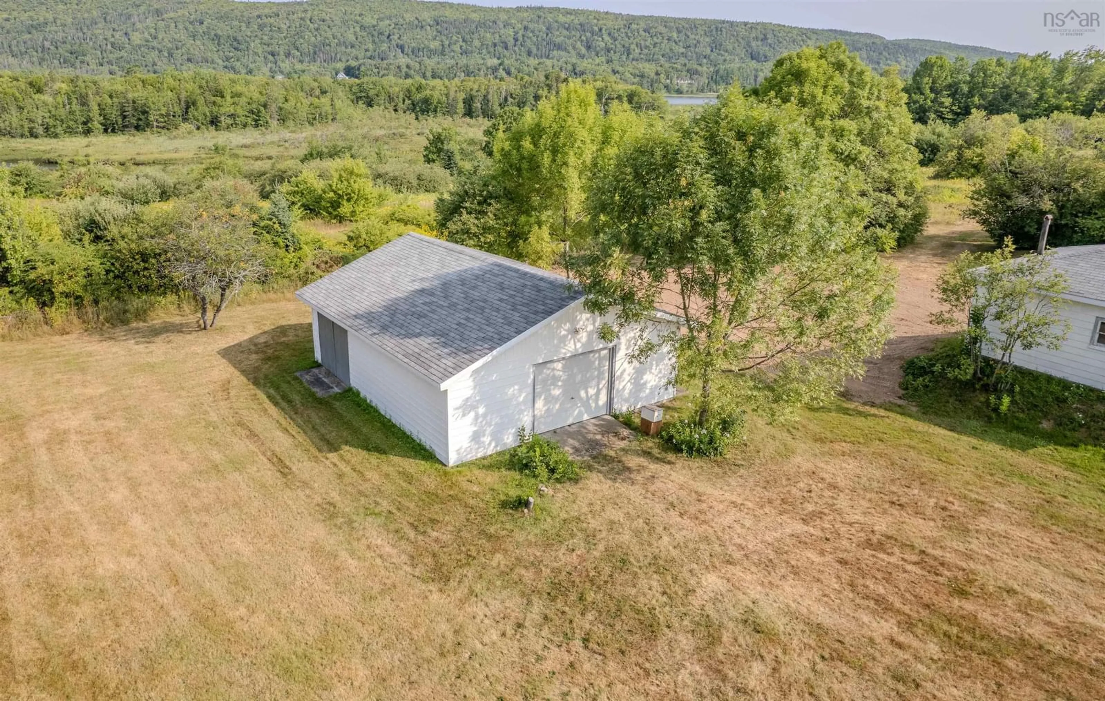A pic from outside/outdoor area/front of a property/back of a property/a pic from drone, unknown for 2450 Kings Rd, Sydney Forks Nova Scotia B1L 1A1
