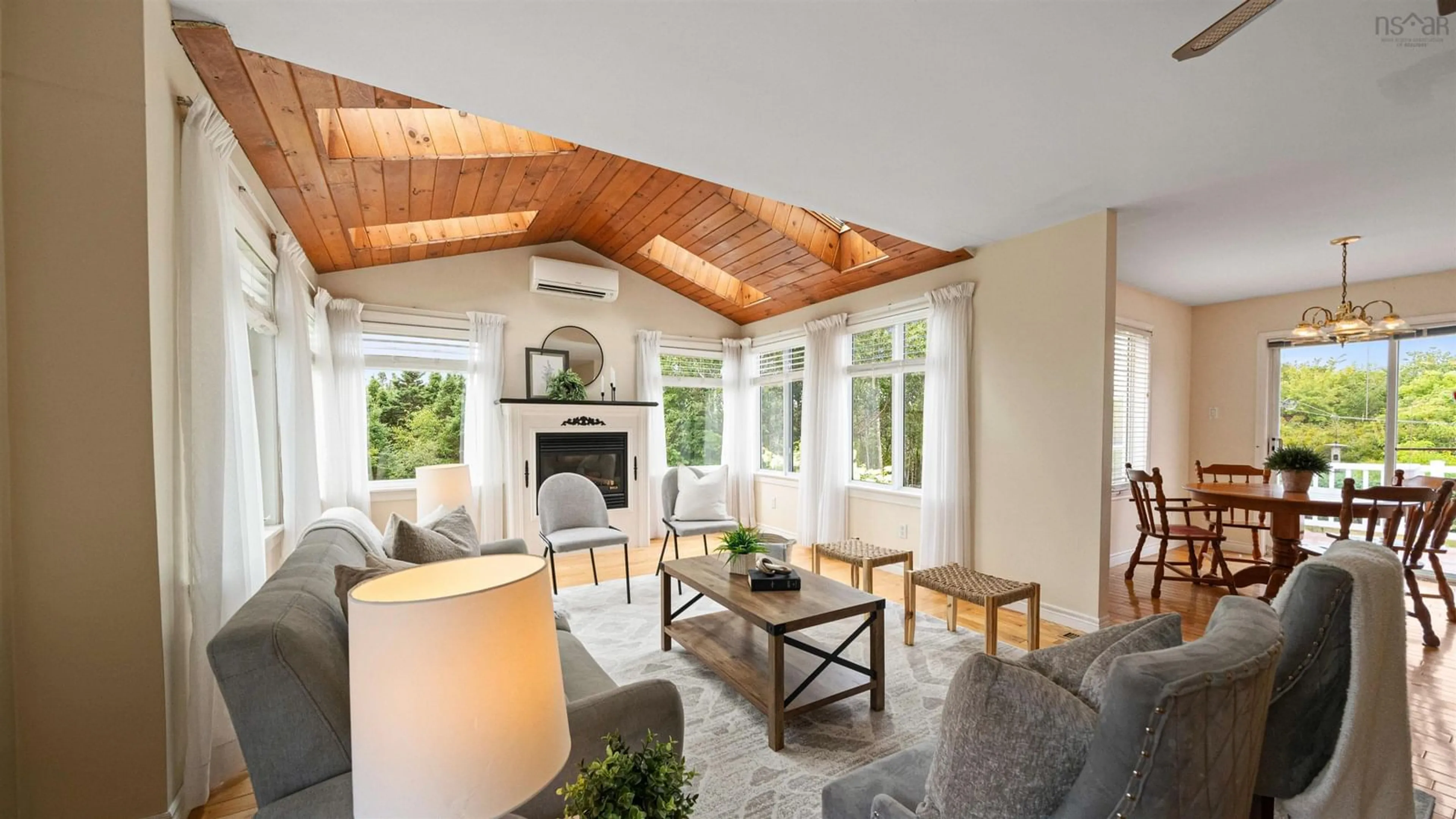 Living room with furniture, wood/laminate floor for 3387 Old Sambro Rd, Williamswood Nova Scotia B3V 1E7