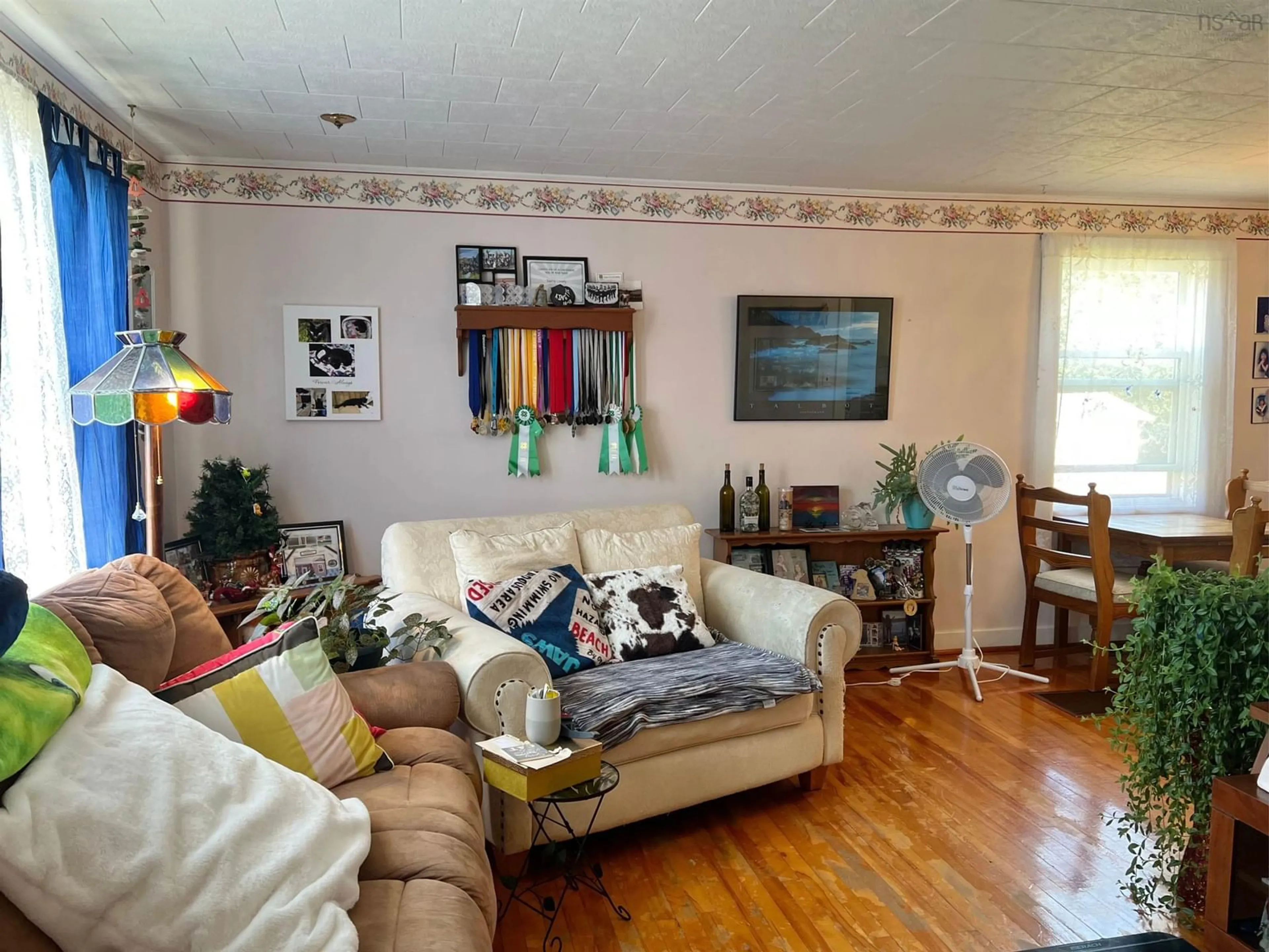 Living room with furniture, wood/laminate floor for 68 Hibernia St, Yarmouth Nova Scotia B5A 2M6