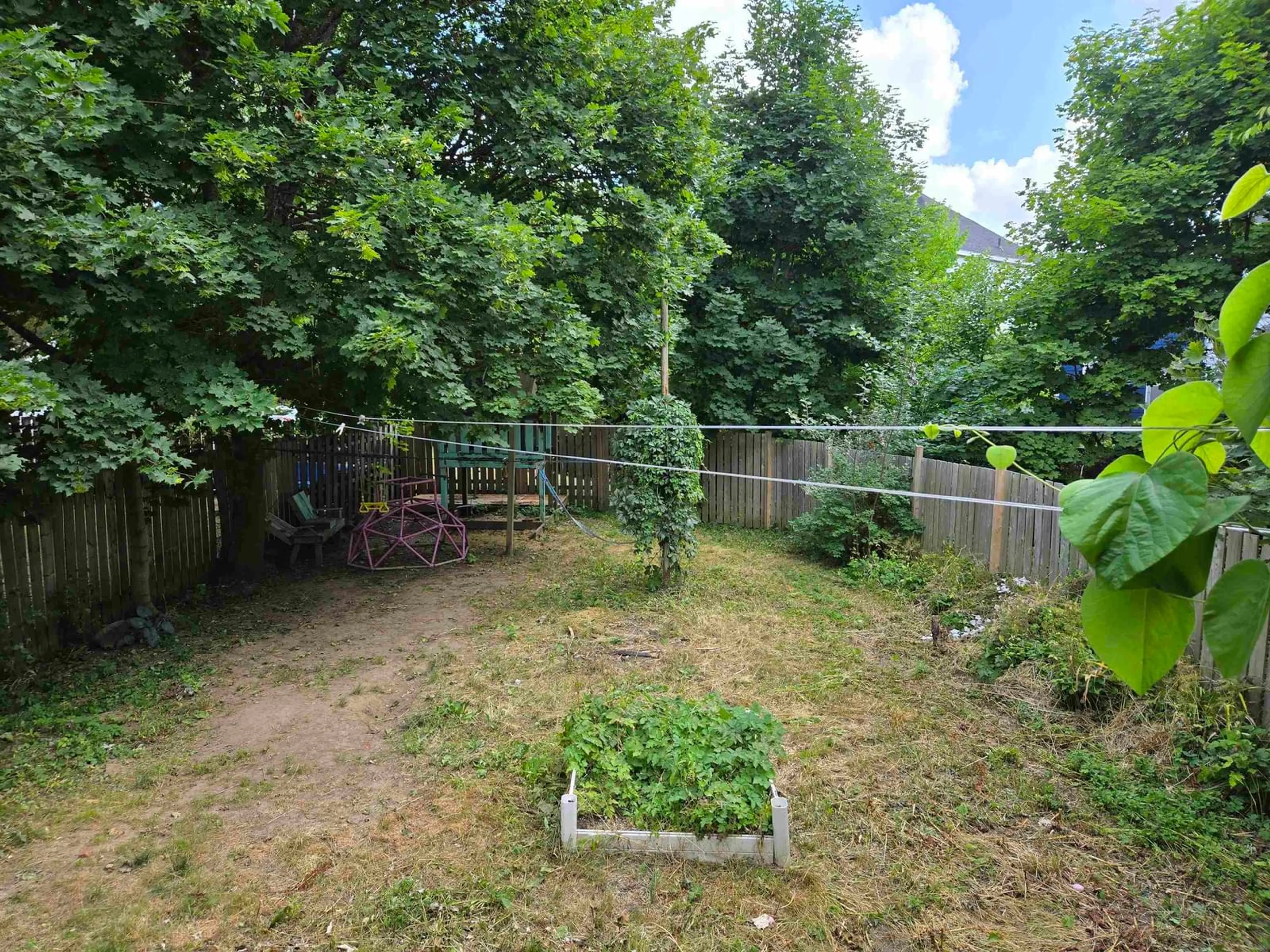 A pic from outside/outdoor area/front of a property/back of a property/a pic from drone, forest/trees view for 106 Brookland St, Sydney Nova Scotia B1P 5B4