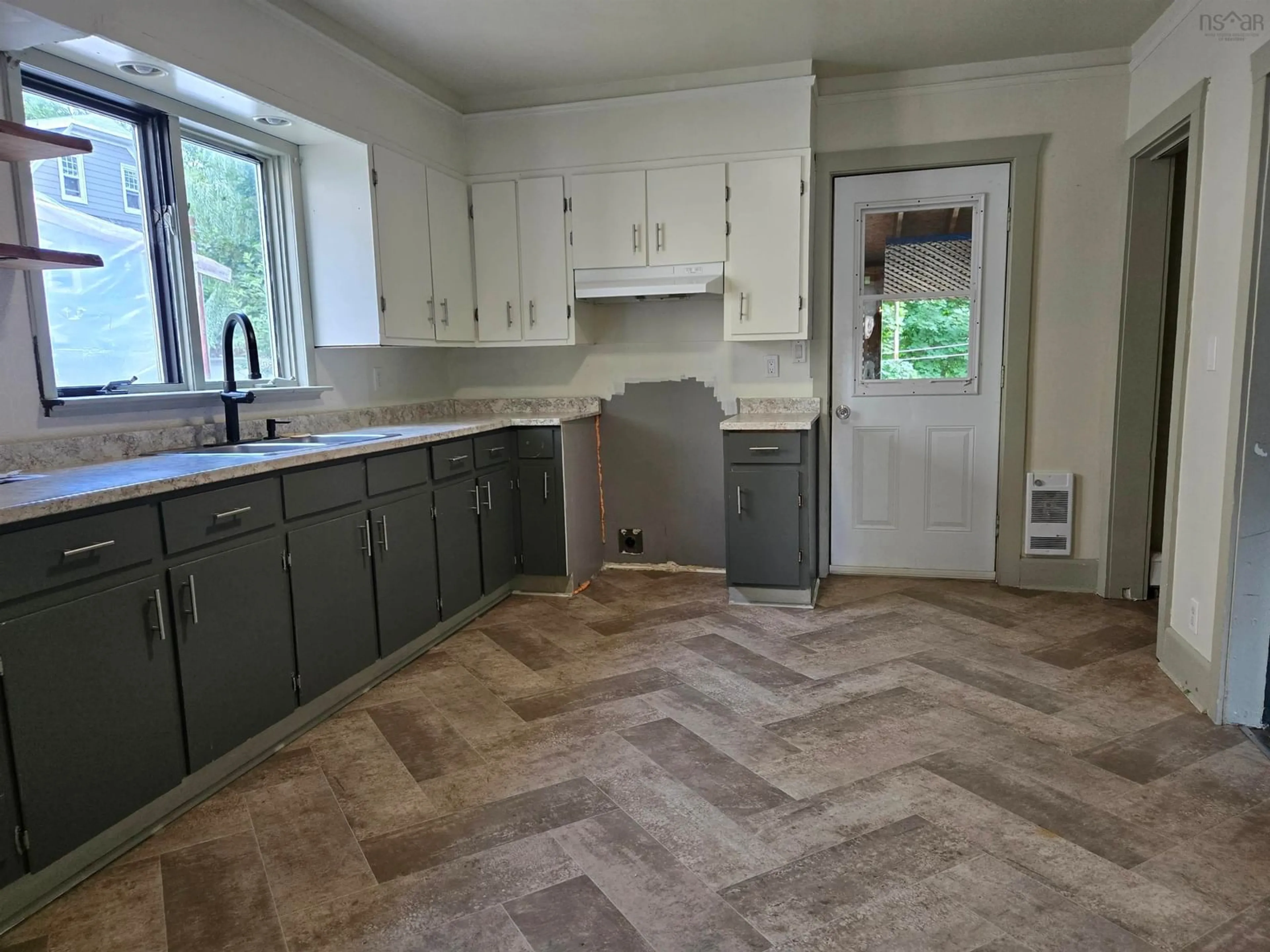 Open concept kitchen, ceramic/tile floor for 106 Brookland St, Sydney Nova Scotia B1P 5B4