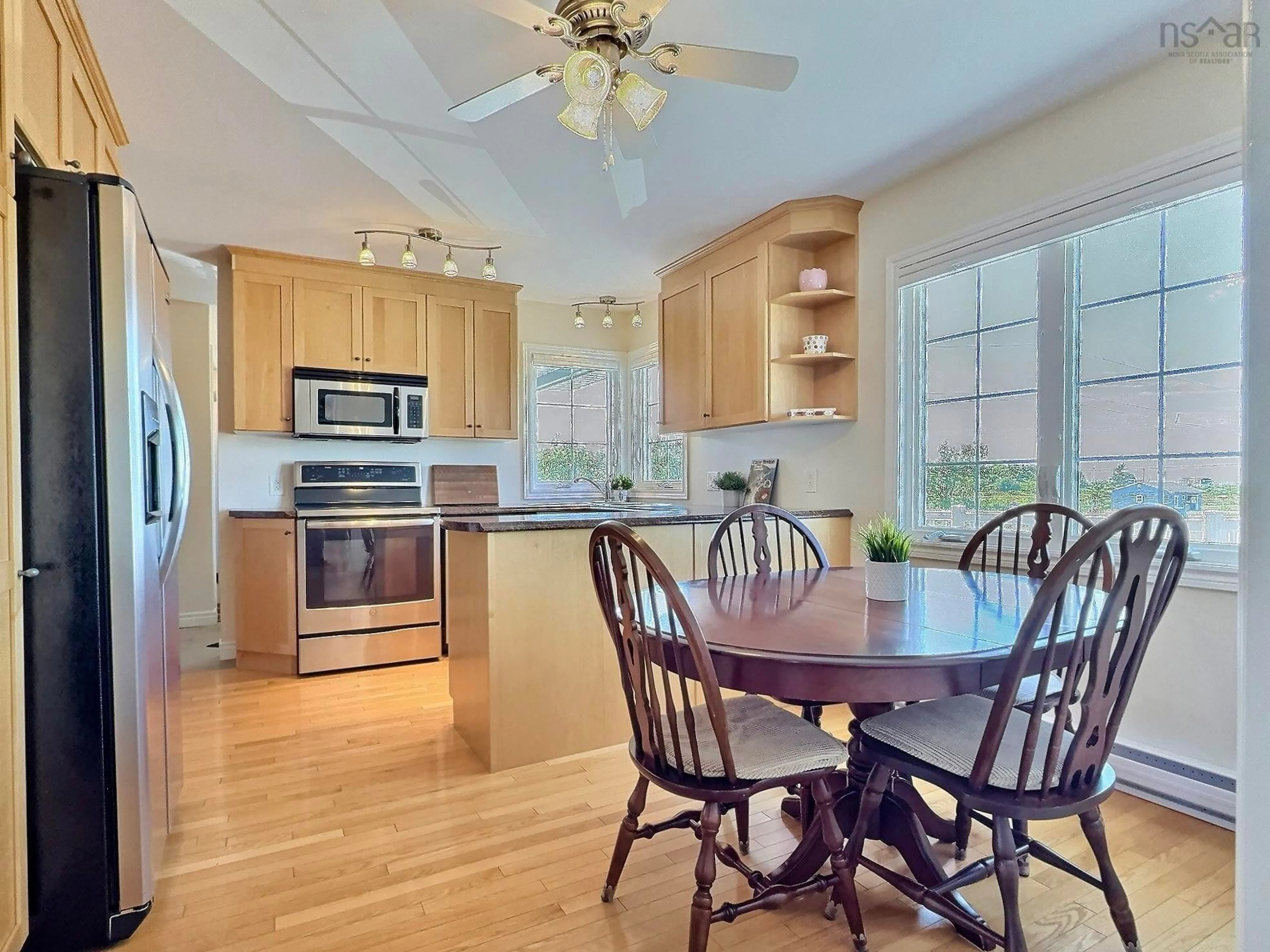 Open concept kitchen, wood/laminate floor for 13642 Cabot Trail Rd, Point Cross Nova Scotia B0E 1H0