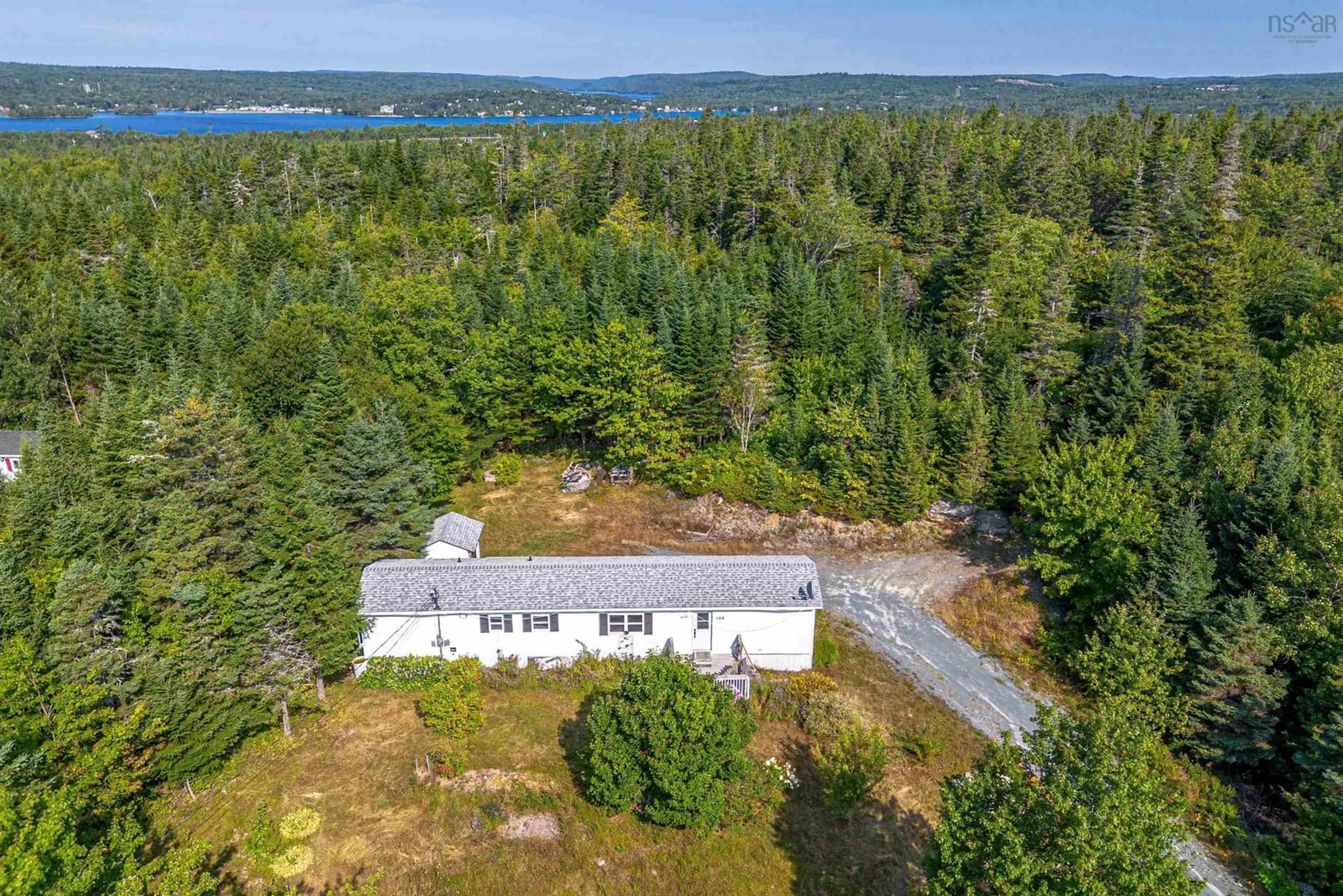 A pic from outside/outdoor area/front of a property/back of a property/a pic from drone, water/lake/river/ocean view for 169 Les Collins Ave, West Chezzetcook Nova Scotia B0J 1N0