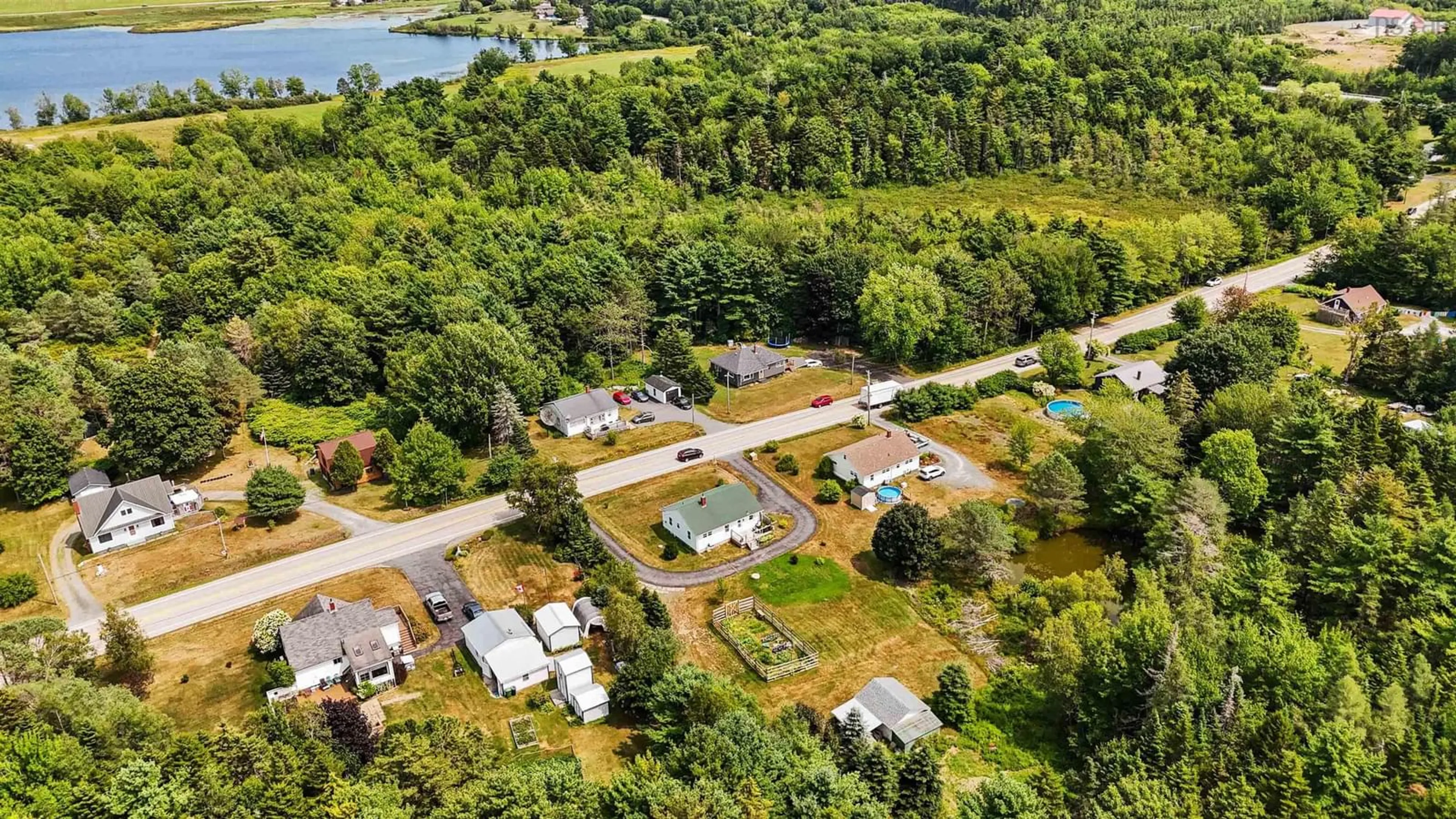 A pic from outside/outdoor area/front of a property/back of a property/a pic from drone, water/lake/river/ocean view for 11407 Highway 3, Centre Nova Scotia B0J 2C0