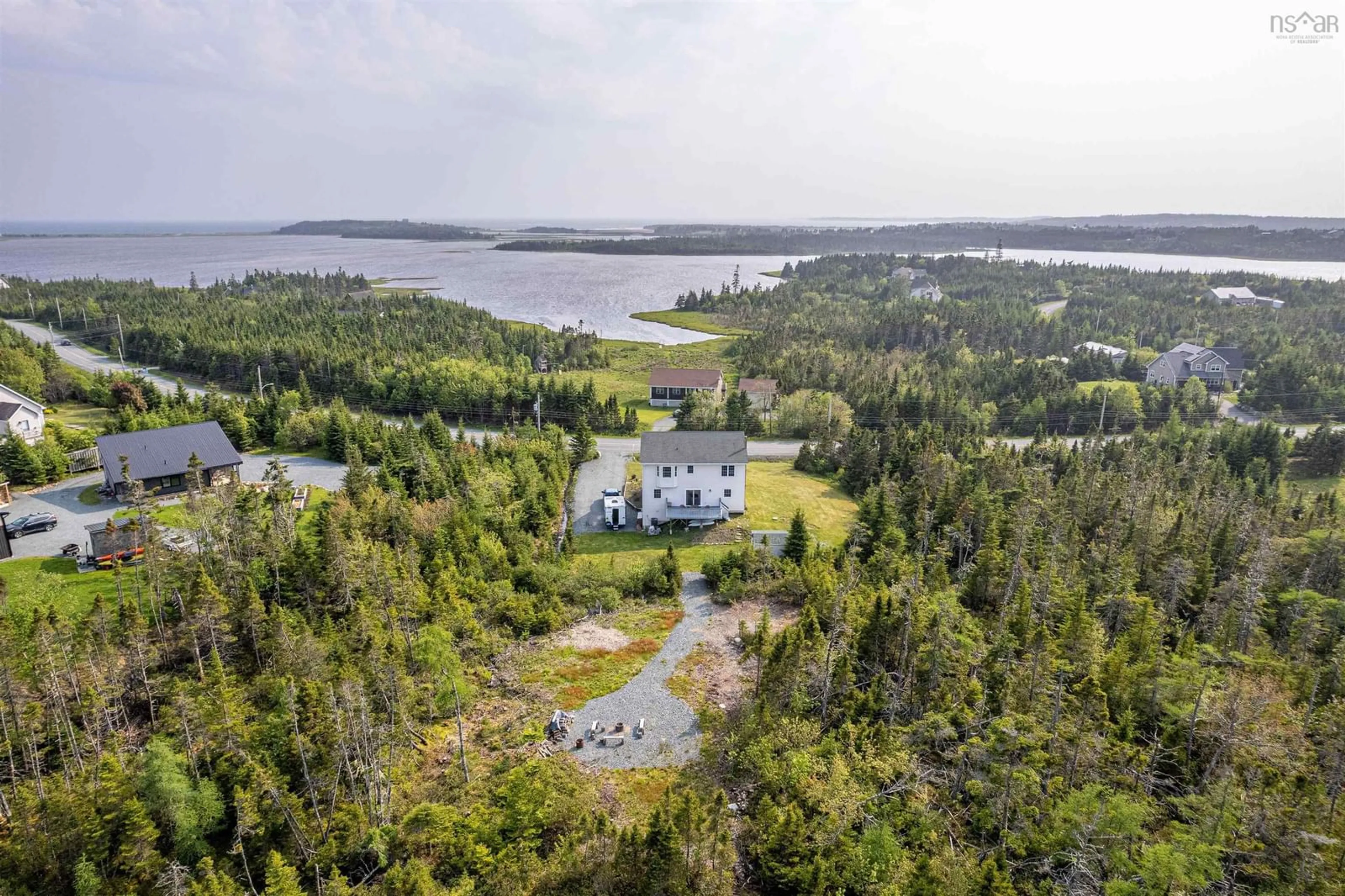 A pic from outside/outdoor area/front of a property/back of a property/a pic from drone, water/lake/river/ocean view for 297 Leslie Rd, East Lawrencetown Nova Scotia B2Z 1T4