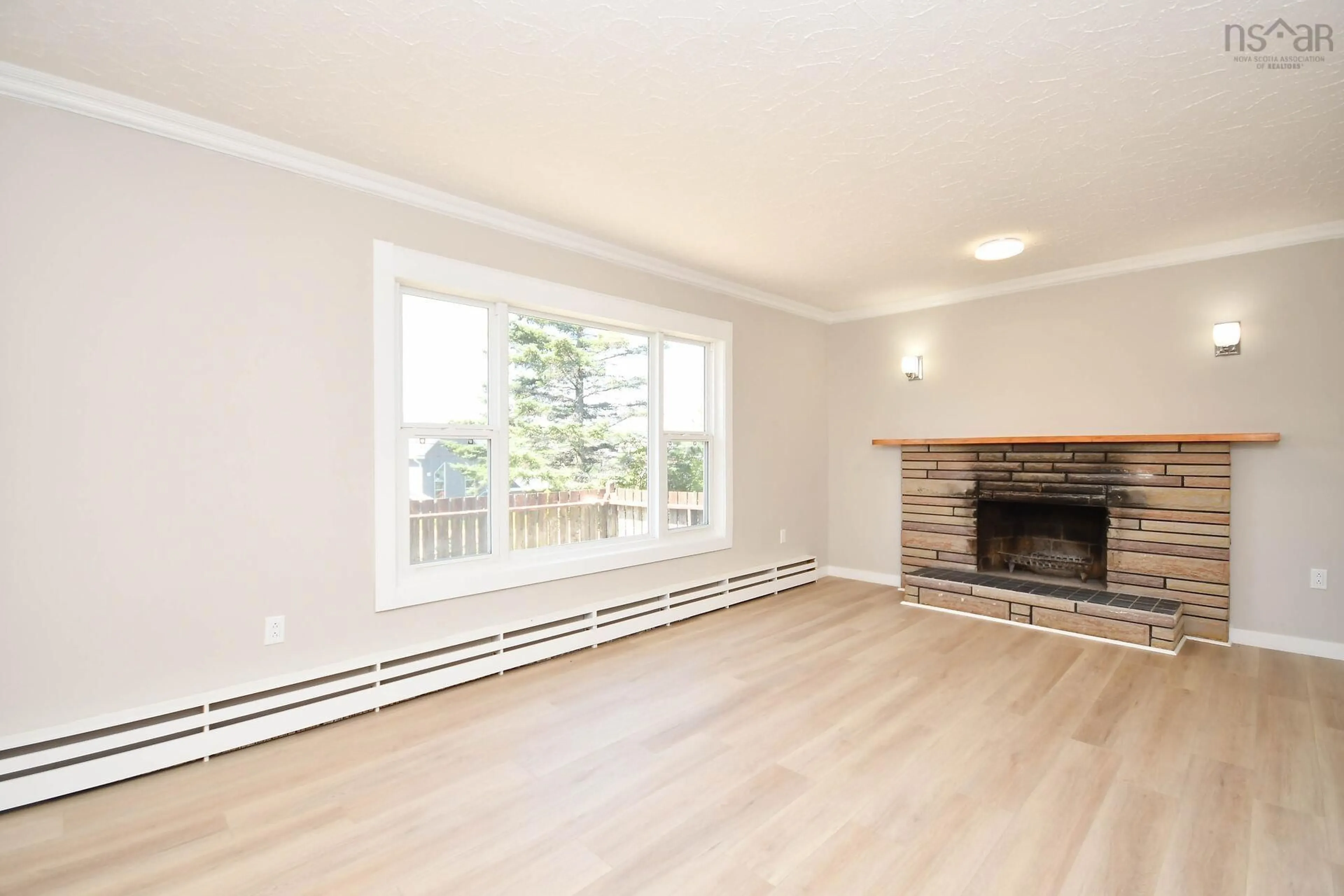 Living room with furniture, wood/laminate floor for 18 Bissett Rd, Cole Harbour Nova Scotia B2V 2T1