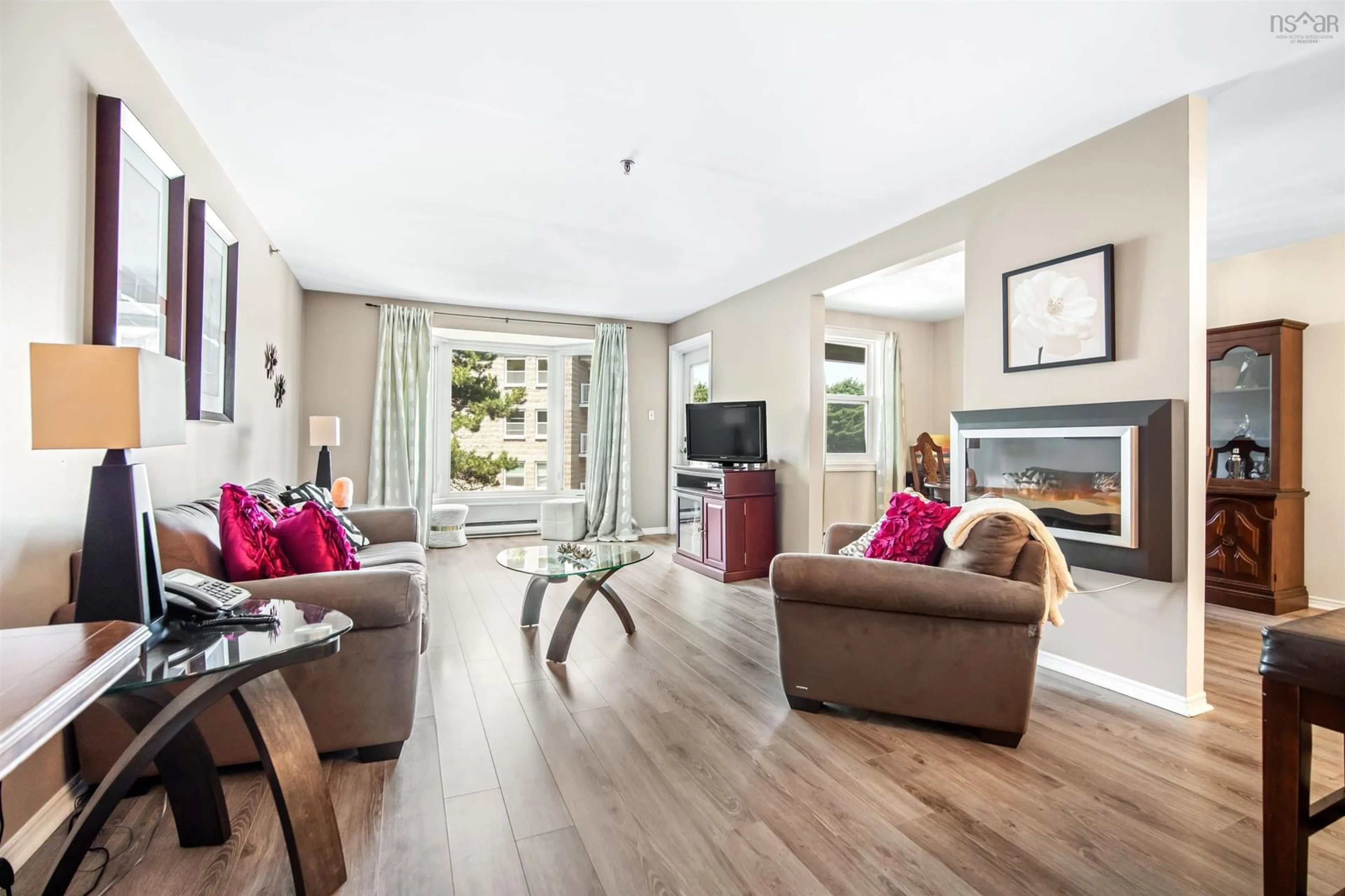 Living room with furniture, wood/laminate floor for 87 Kearney Lake Road #309, Halifax Nova Scotia B3M 4H1