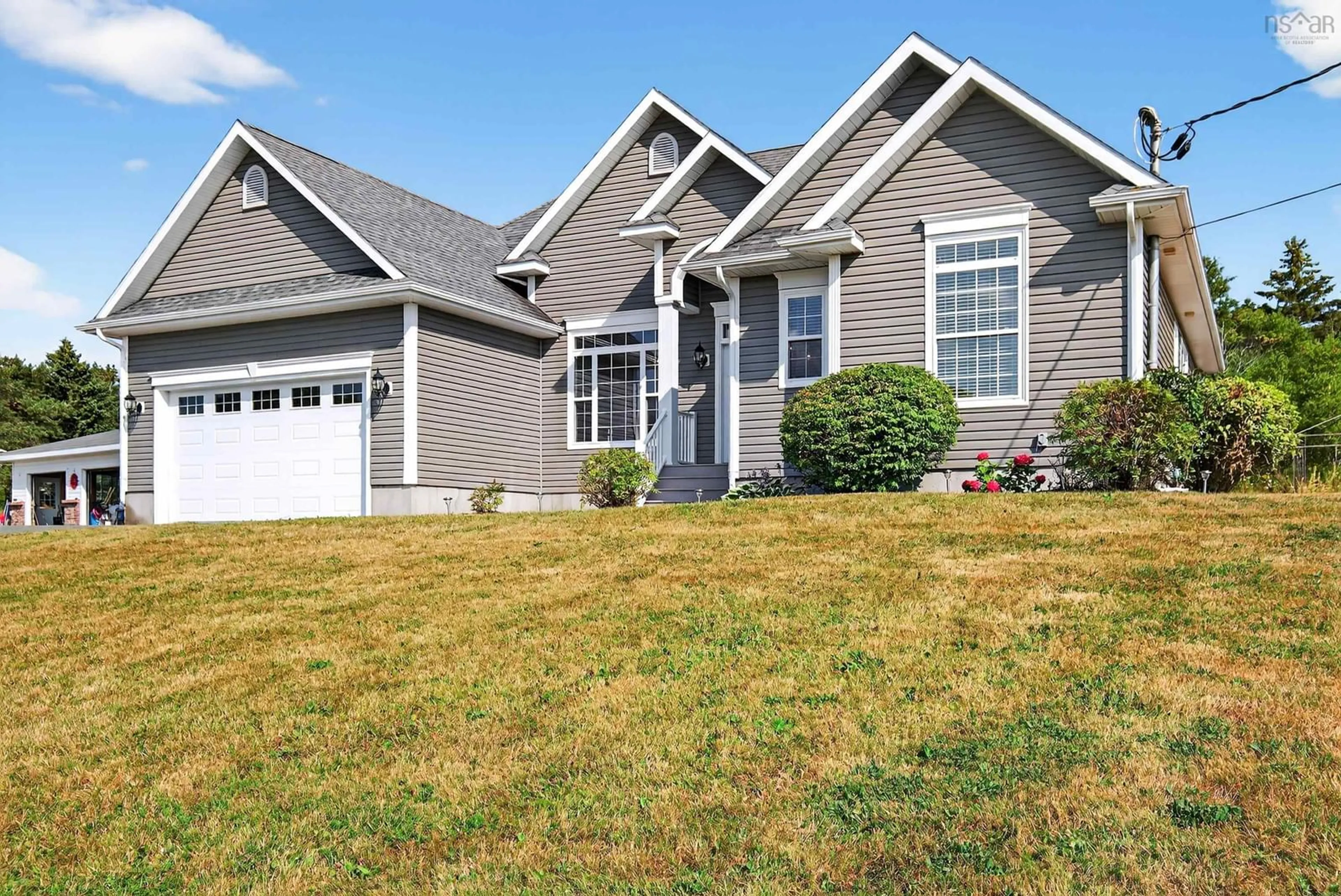 Home with vinyl exterior material, street for 22 Helens Avenue, Georges River Nova Scotia B1Y 3G4