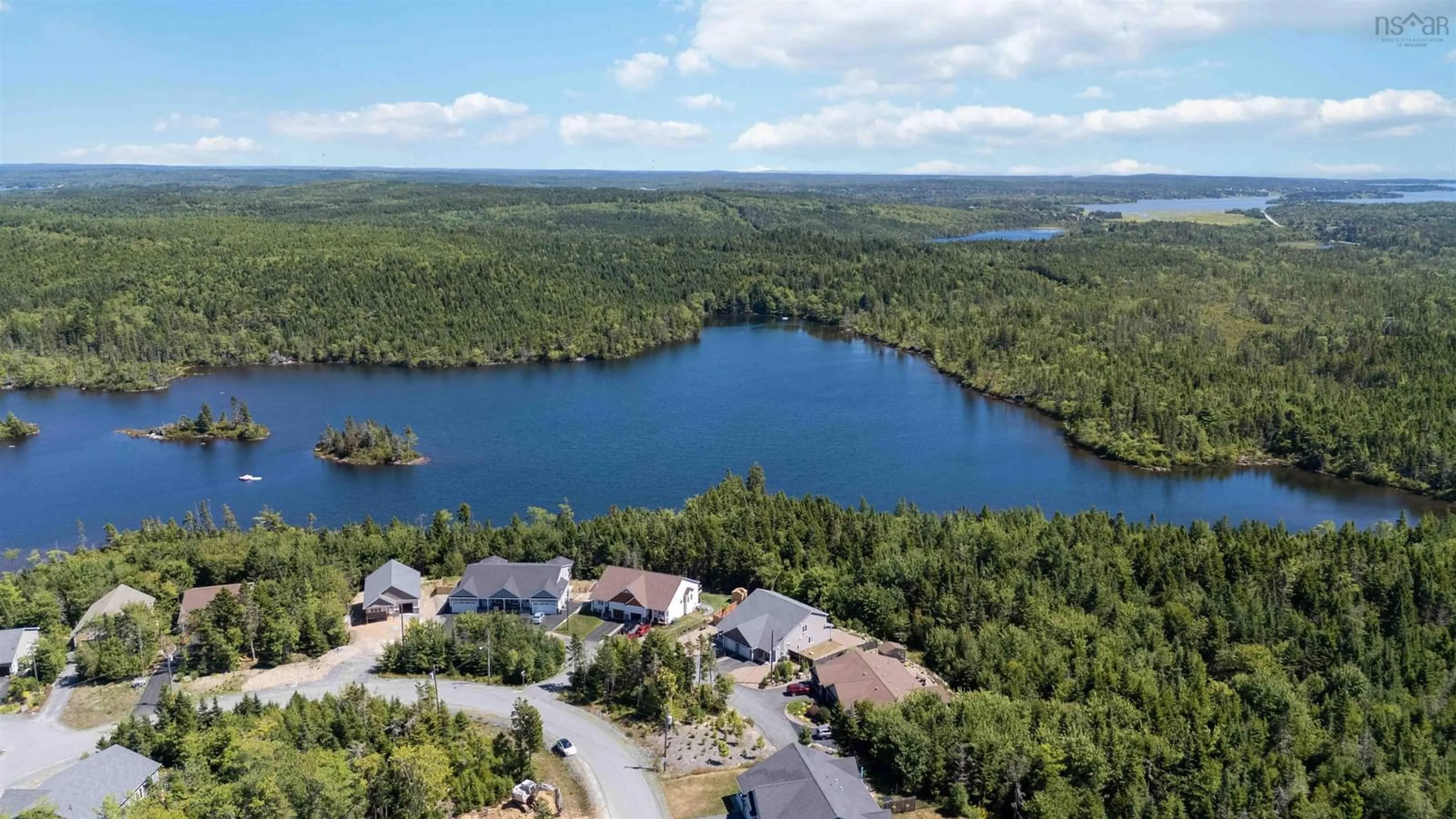 A pic from outside/outdoor area/front of a property/back of a property/a pic from drone, water/lake/river/ocean view for 11 Peaceful Pl, Porters Lake Nova Scotia B3E 0E6