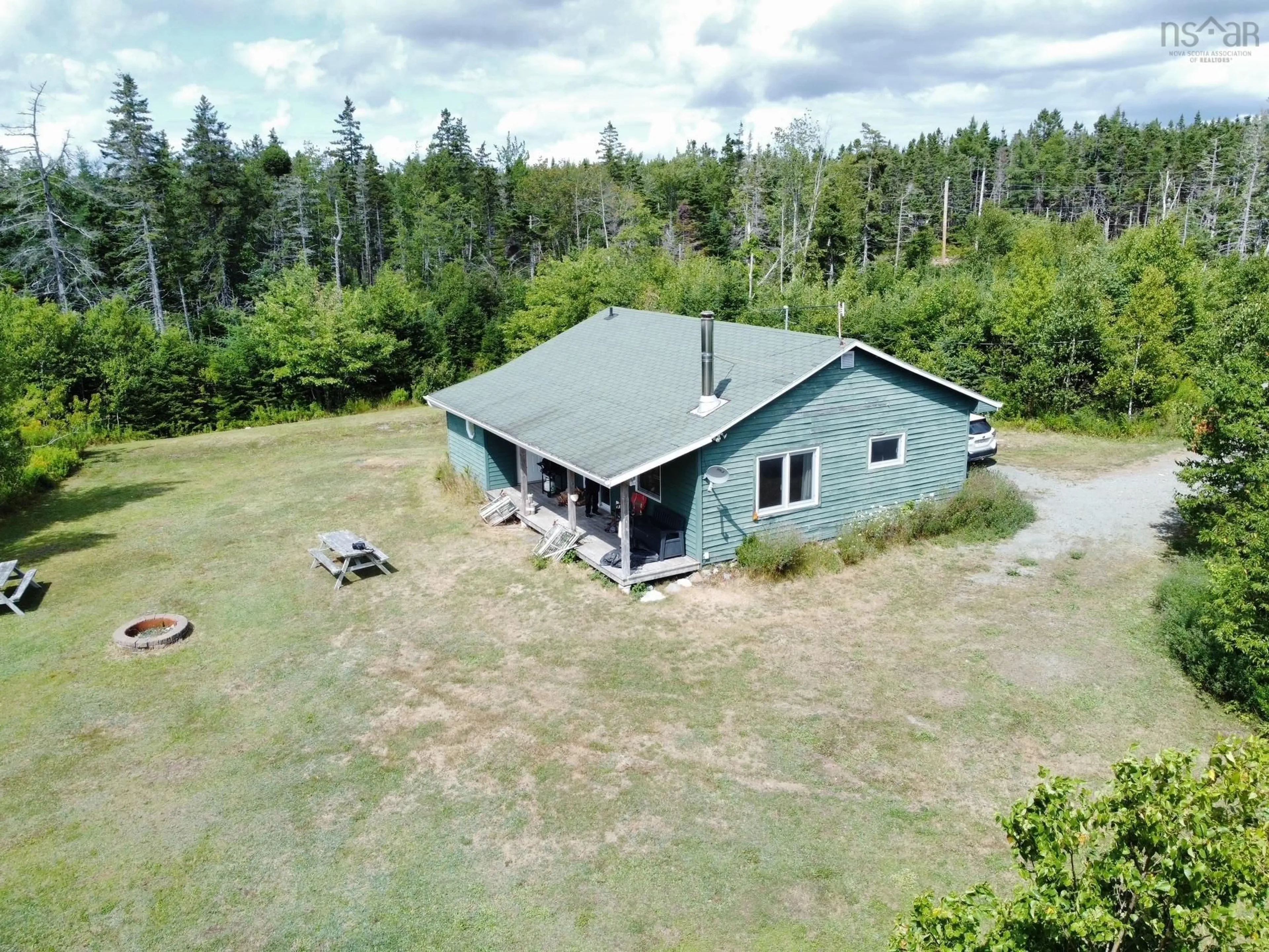 A pic from outside/outdoor area/front of a property/back of a property/a pic from drone, building for 311 Richards Pond Rd, River Bourgeois Nova Scotia B0E 2X0