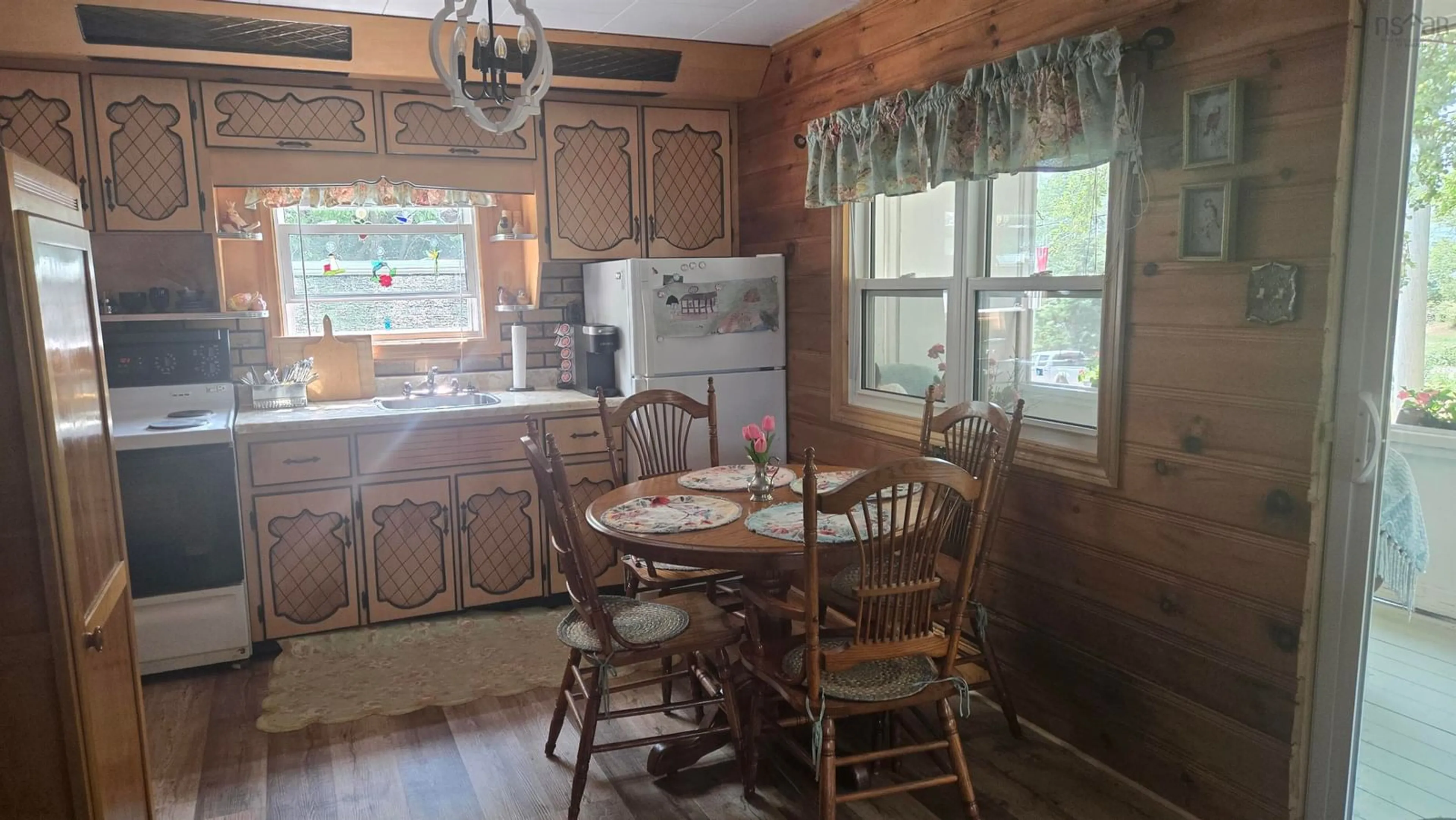 Dining room, wood/laminate floor for 2818 Highway 395, East Lake Ainslie Nova Scotia B0E 3M0
