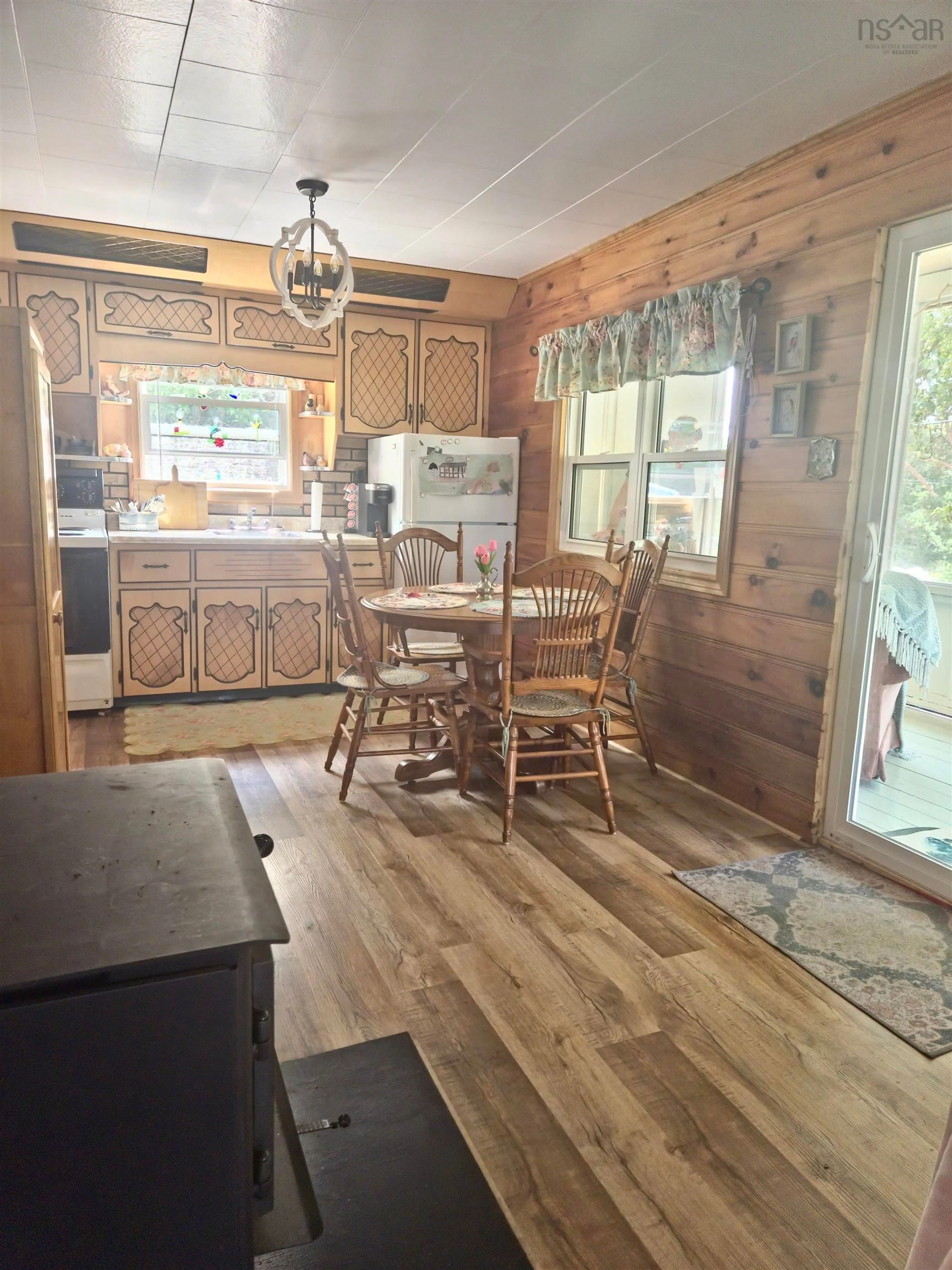 Open concept kitchen, wood/laminate floor for 2818 Highway 395, East Lake Ainslie Nova Scotia B0E 3M0