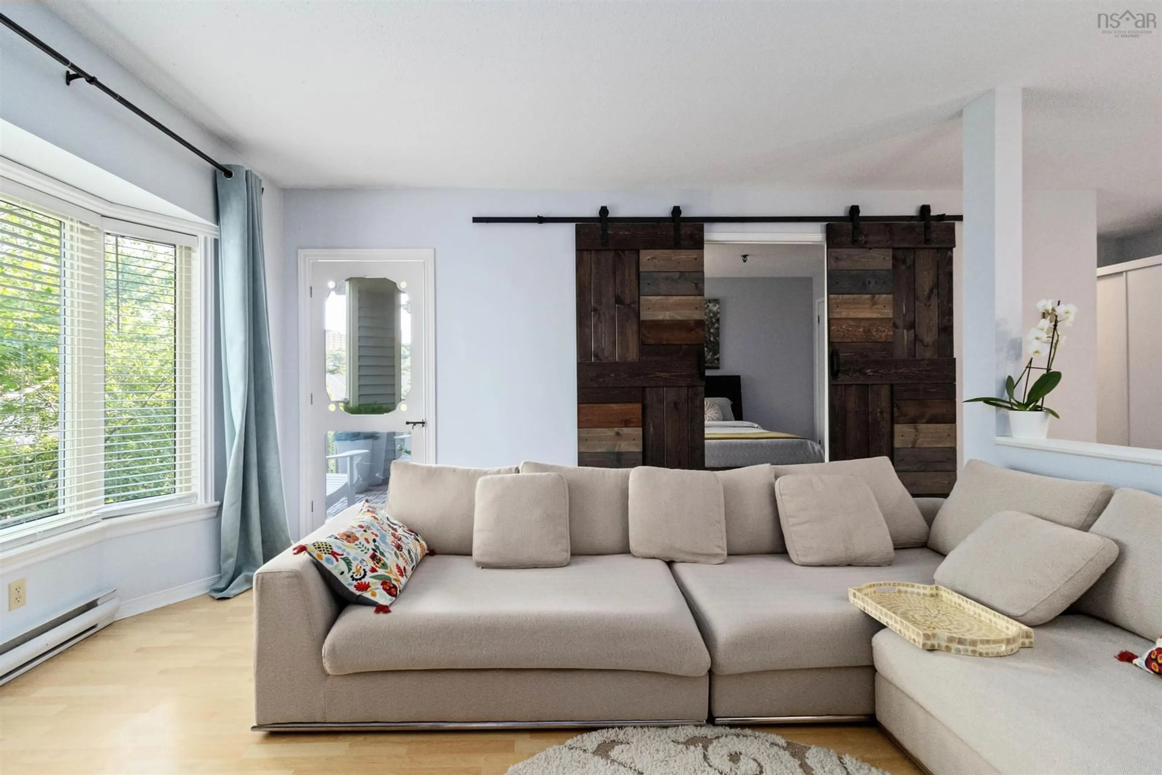 Living room with furniture, wood/laminate floor for 12 Spinnaker Dr #407, Halifax Nova Scotia B3N 3A8