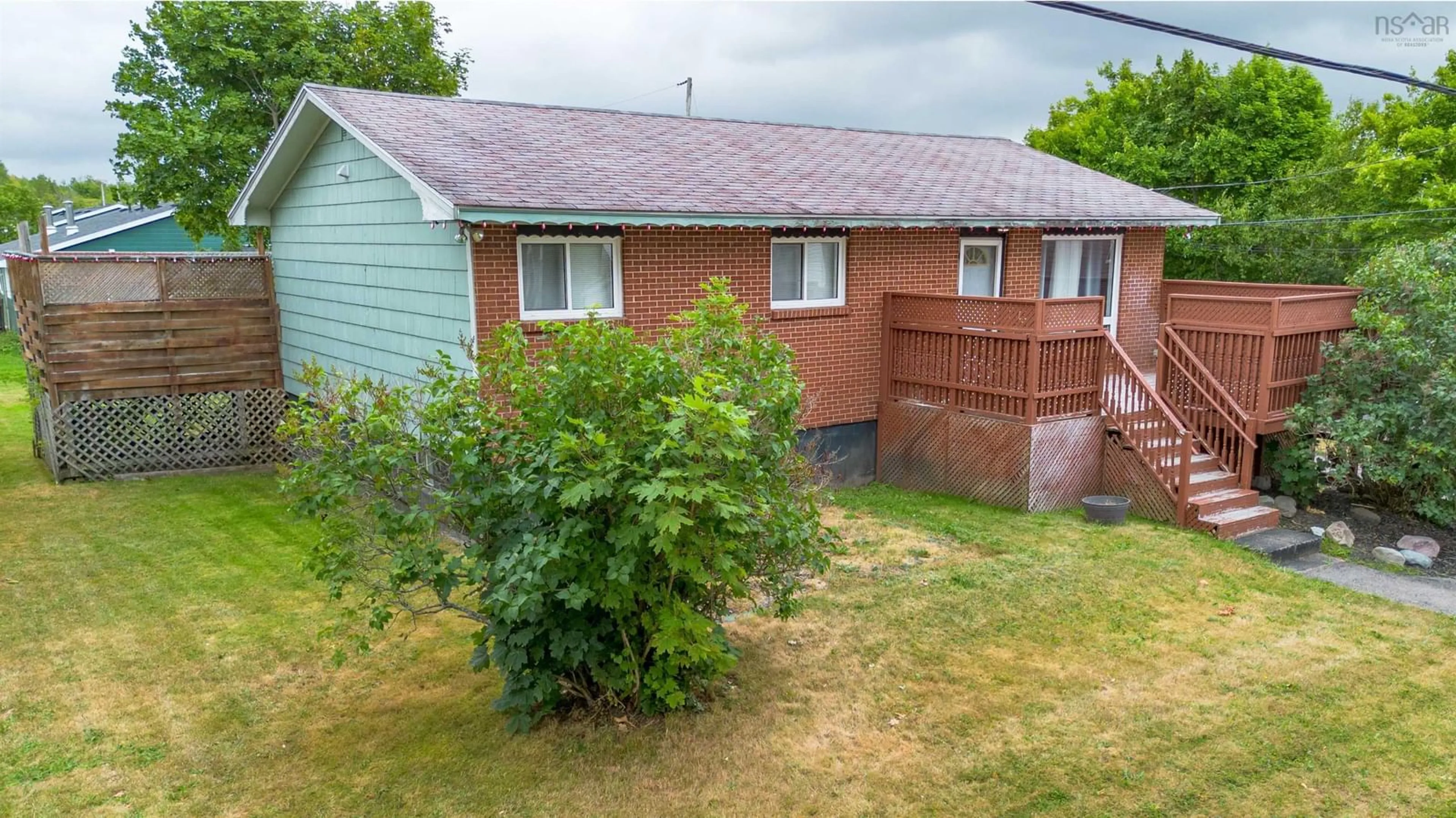 A pic from outside/outdoor area/front of a property/back of a property/a pic from drone, unknown for 201 Gatacre St, Sydney Nova Scotia B1N 1Z3