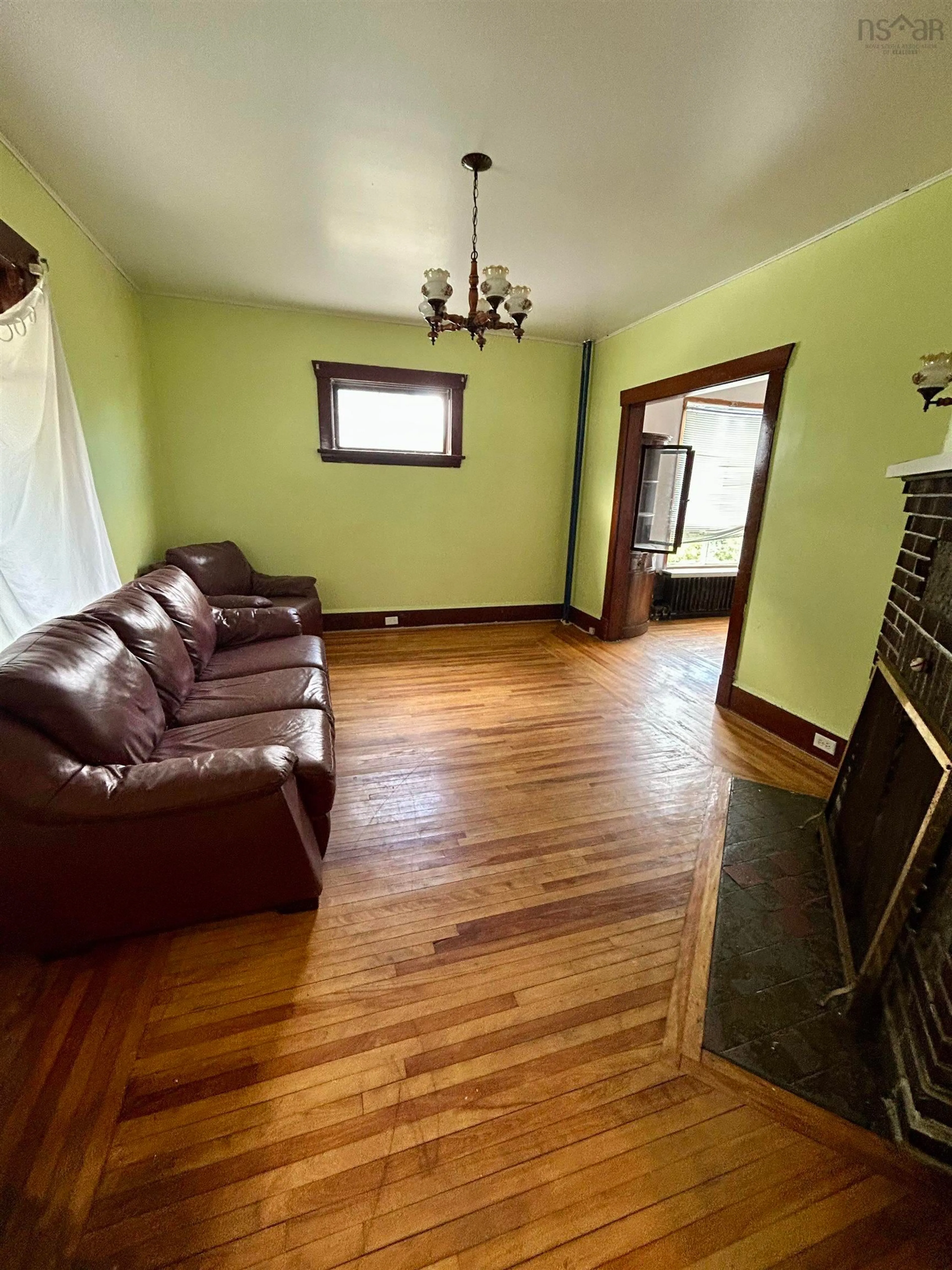 Living room with furniture, unknown for 128 Inglis St., Sydney Nova Scotia B1P 1W8
