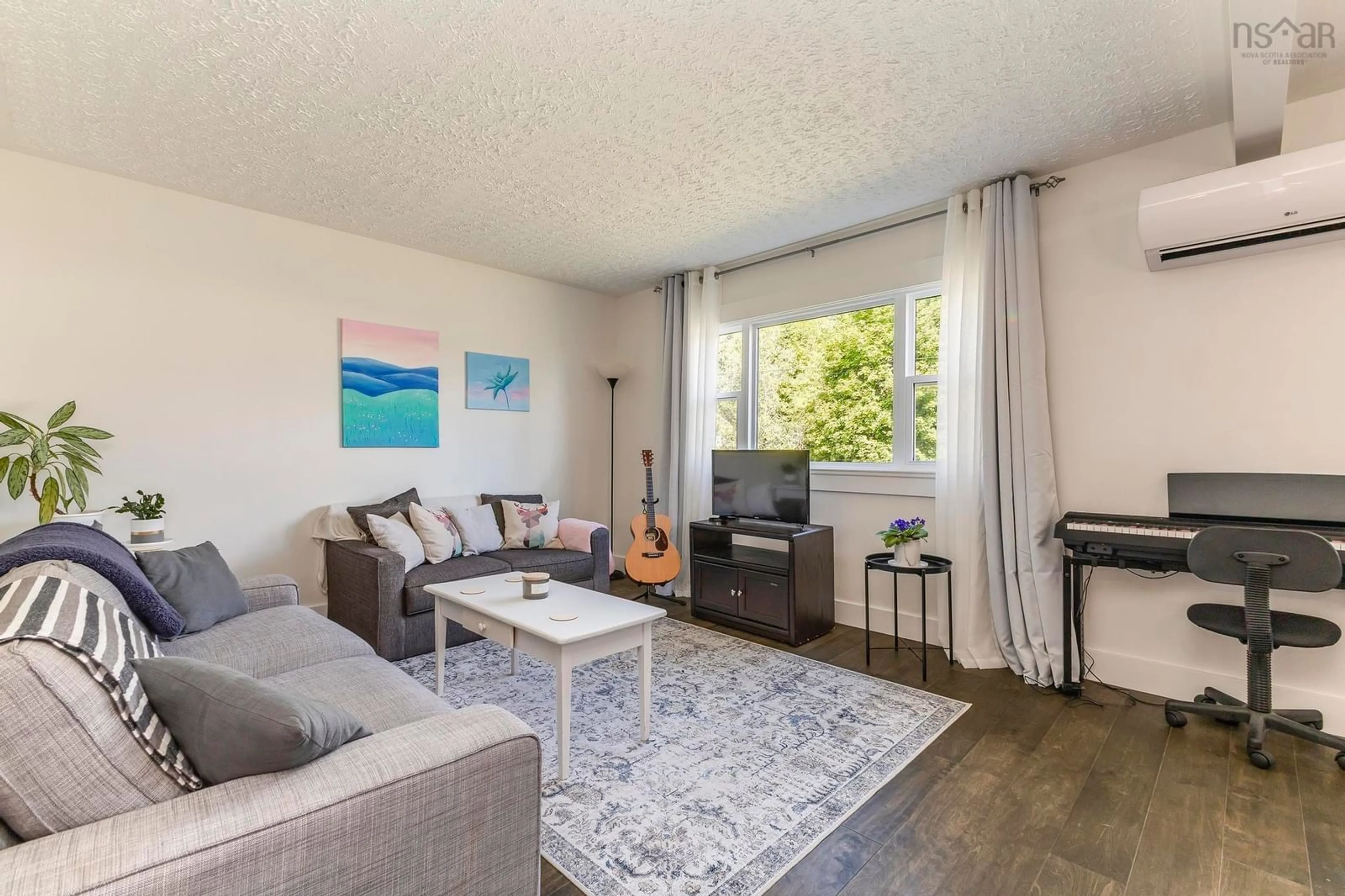 Living room with furniture, wood/laminate floor for 498 Birch St, New Glasgow Nova Scotia B2H 1Y1