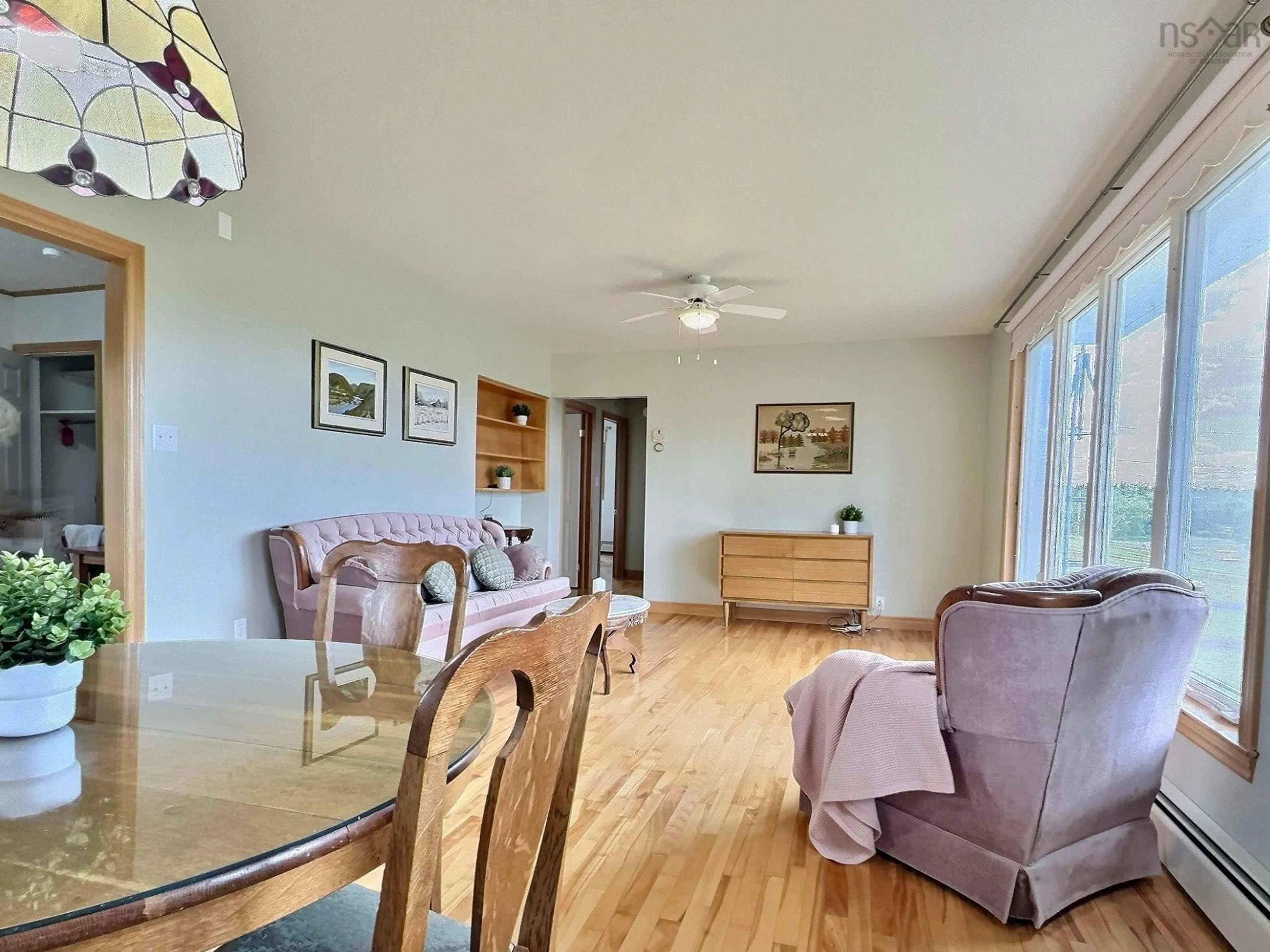 Living room with furniture, wood/laminate floor for 902 Cheticamp Back Rd, Belle Marche Nova Scotia B0E 1H0