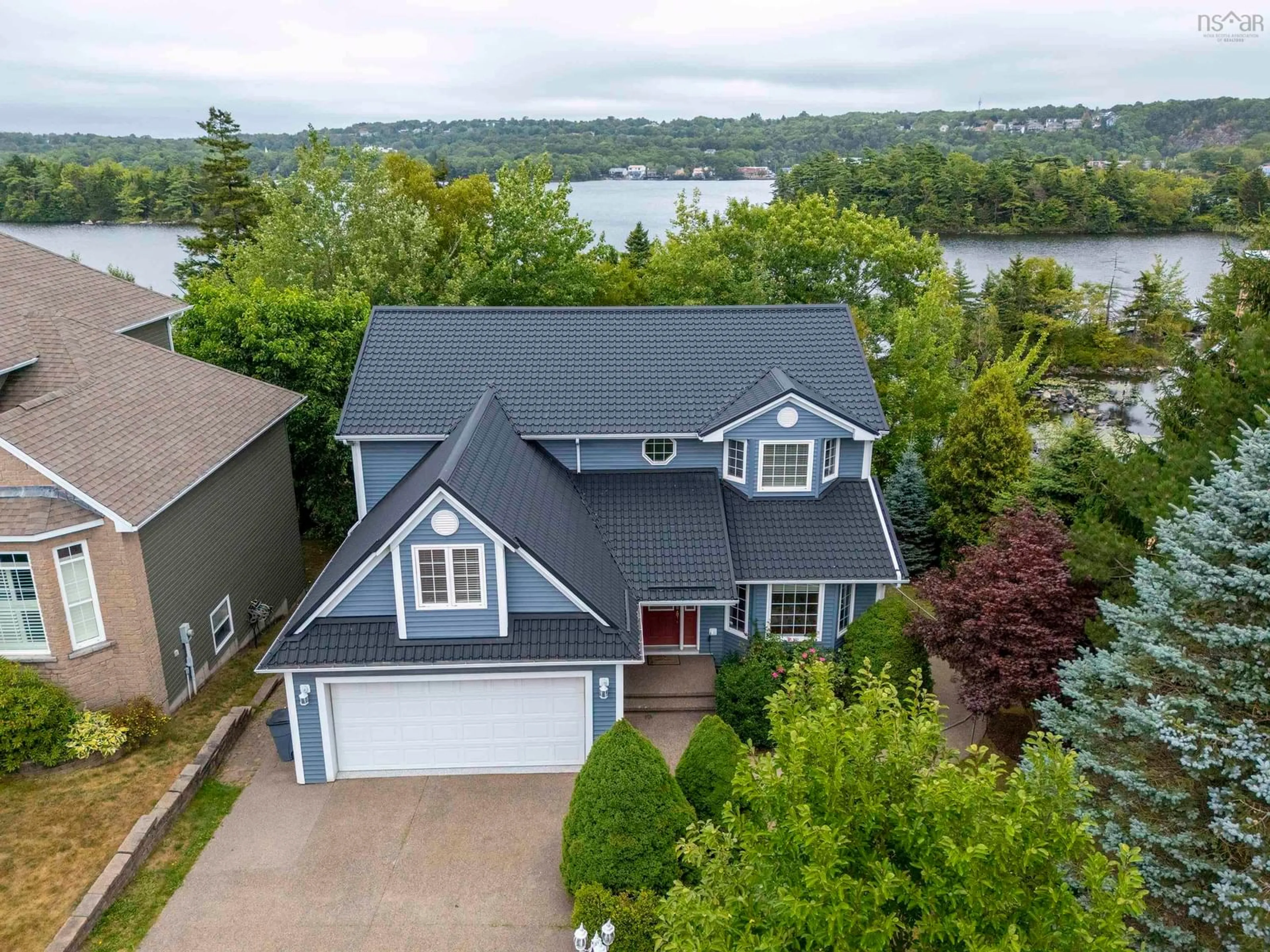 A pic from outside/outdoor area/front of a property/back of a property/a pic from drone, water/lake/river/ocean view for 23 Lakeshore Park Terr, Dartmouth Nova Scotia B3A 4Z4