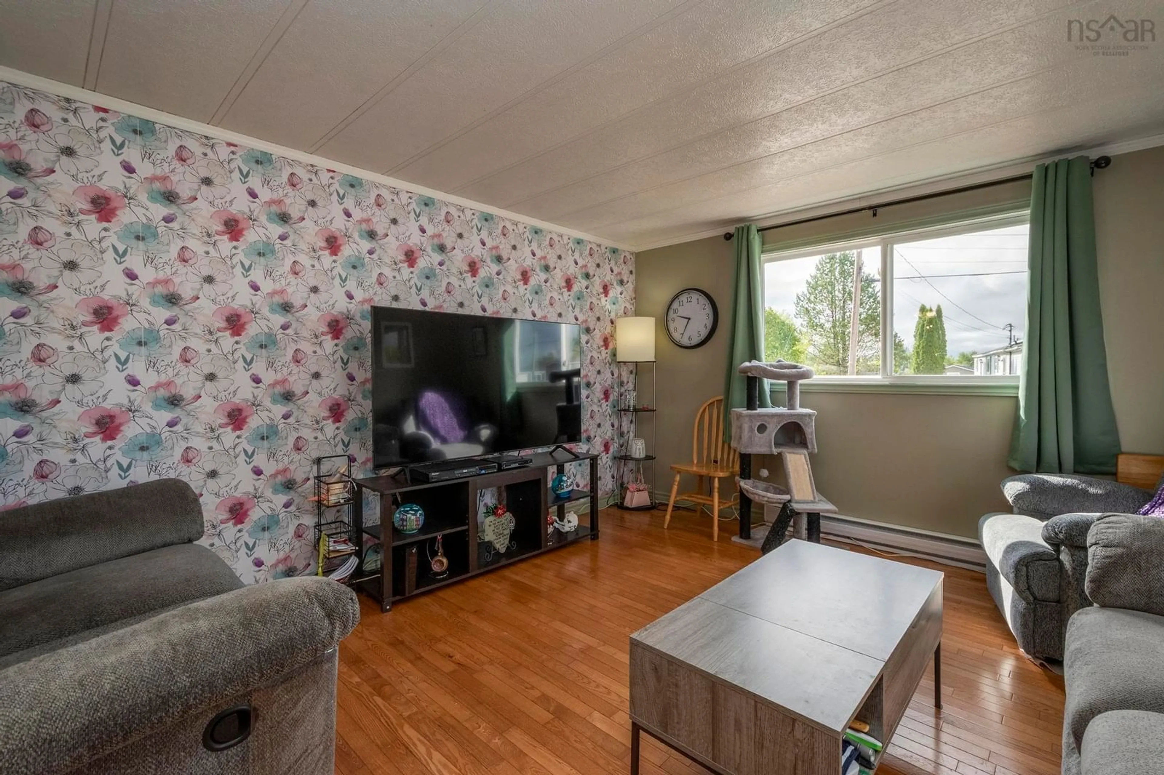 Living room with furniture, wood/laminate floor for 25 Owen Ave, Mount Uniacke Nova Scotia B0N 1Z0
