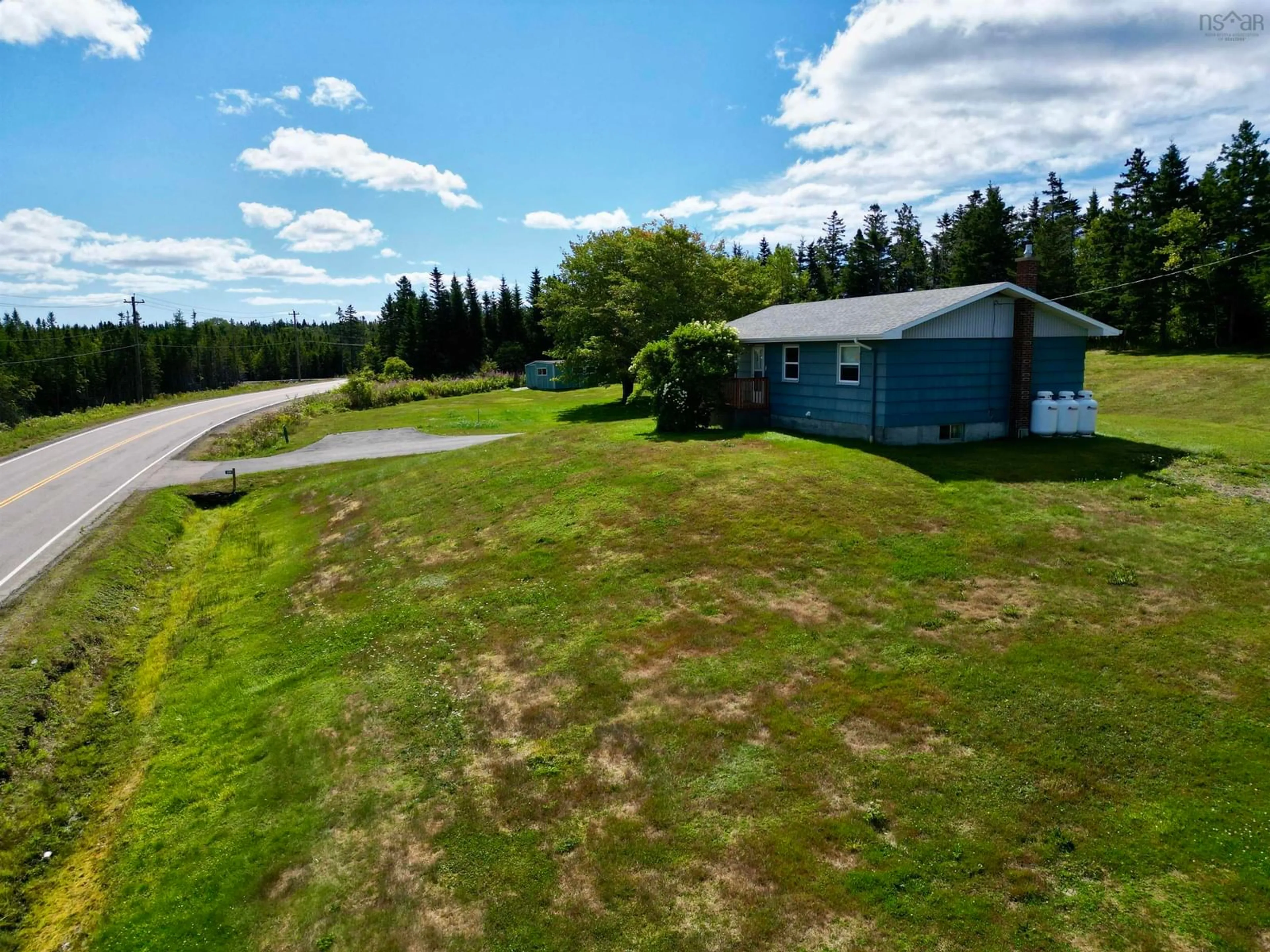 A pic from outside/outdoor area/front of a property/back of a property/a pic from drone, water/lake/river/ocean view for 594 Highway 247, Grand Greve Nova Scotia B0E 3B0