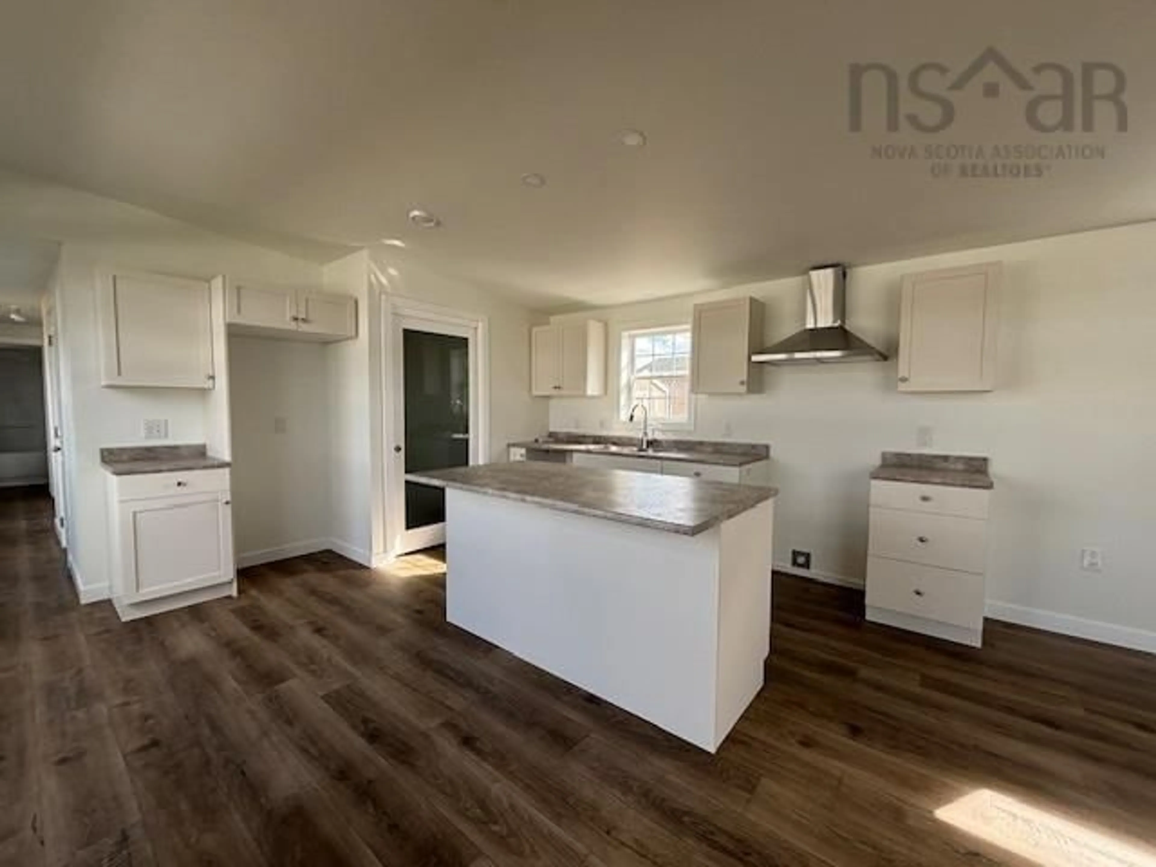 Open concept kitchen, wood/laminate floor for 36 Rogers Dr, Lower South River Nova Scotia B2G 0E7