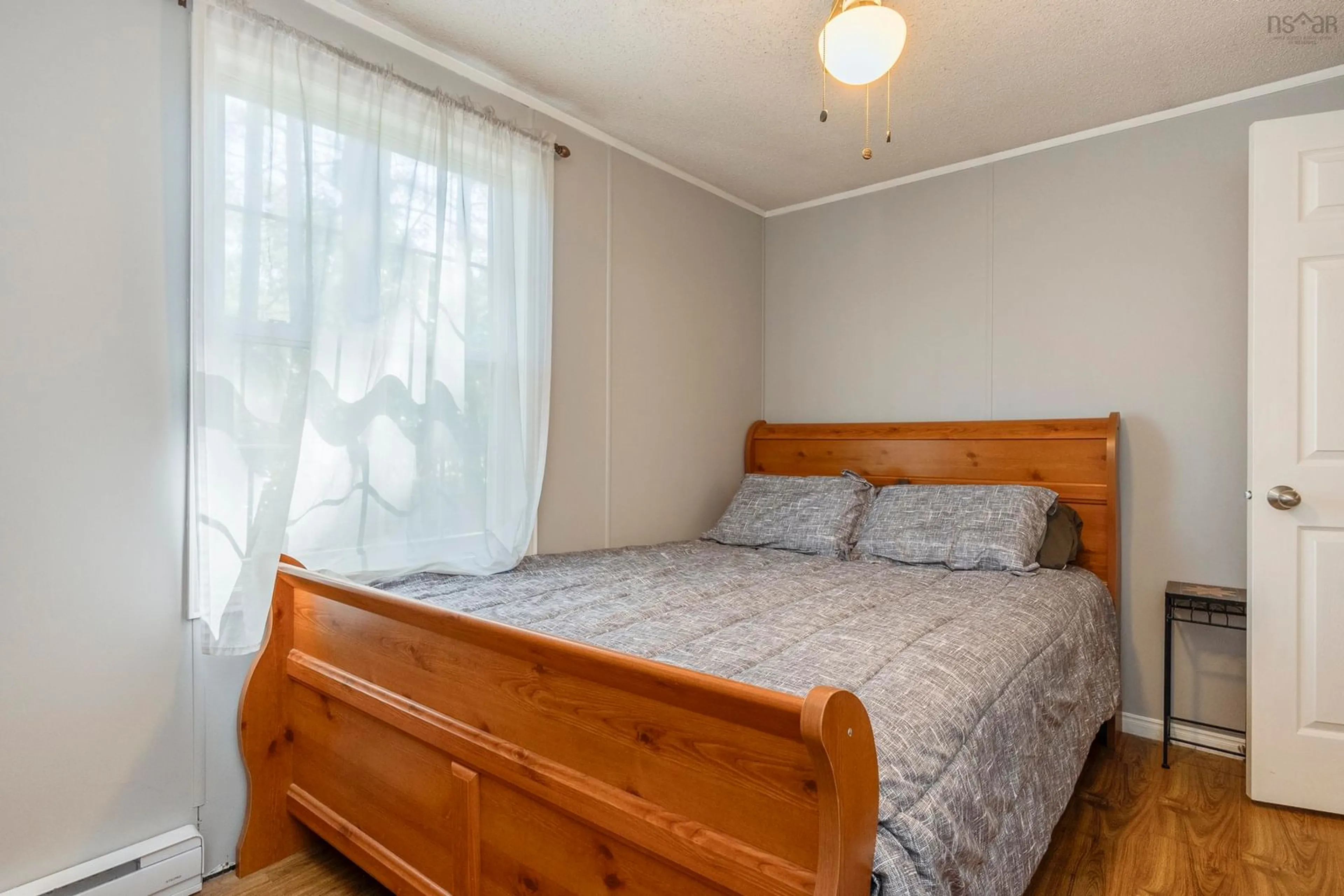 Bedroom with bed, wood/laminate floor for 4 Wicks Dr, Meadowvale Nova Scotia B0P 1R0