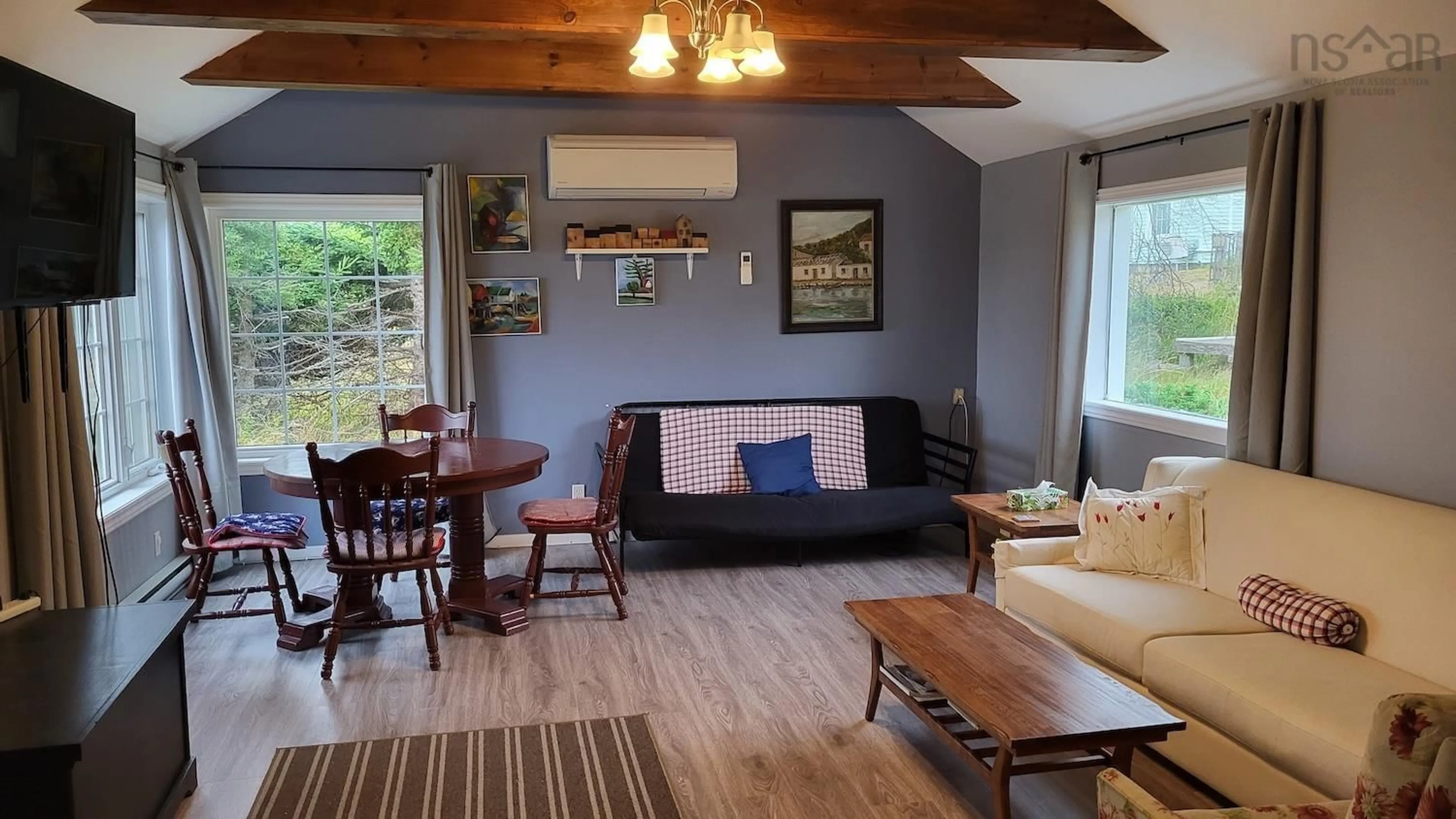 Living room with furniture, wood/laminate floor for 34 Wharf Rd, Bush Island Nova Scotia B0R 1C0