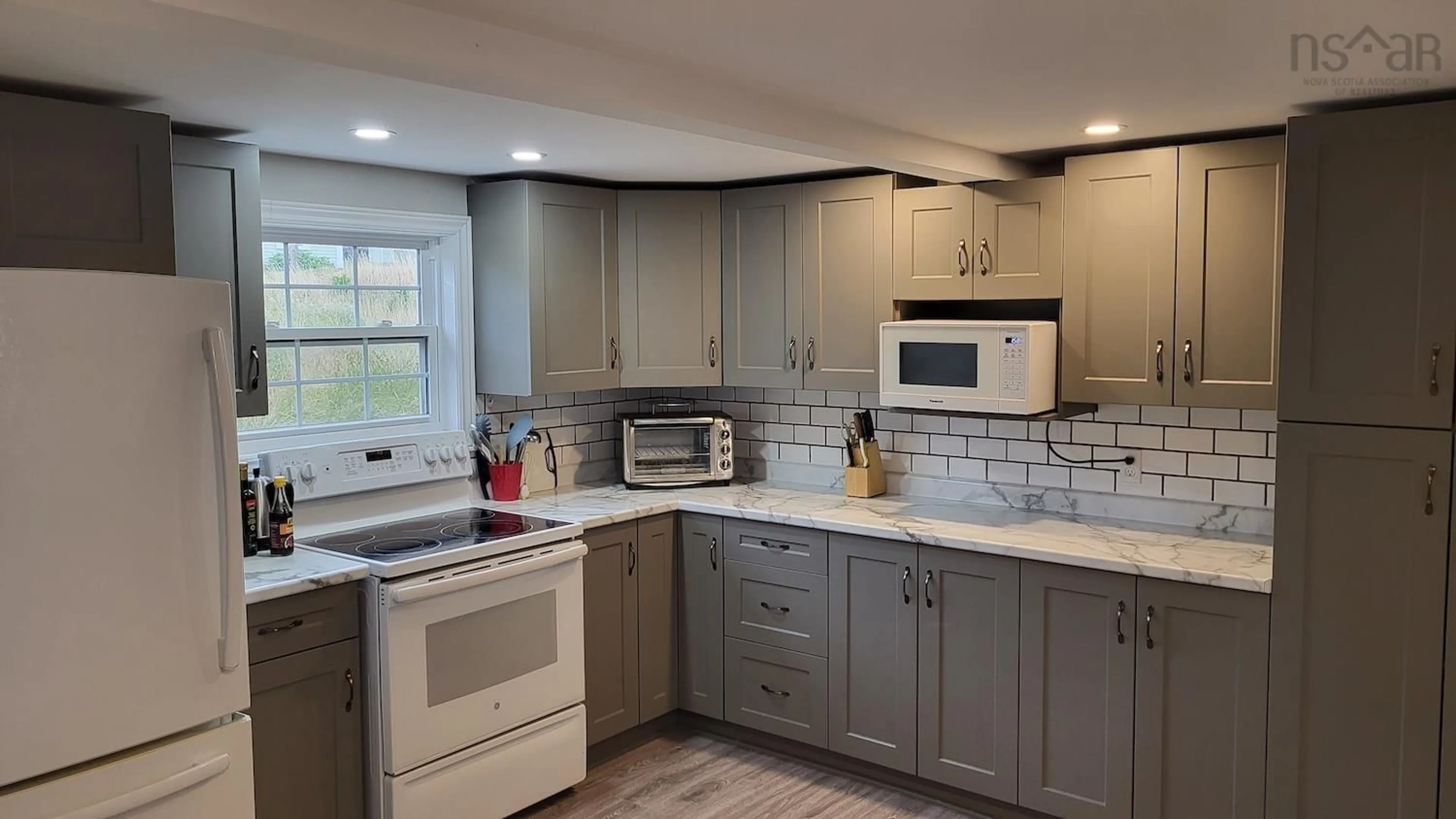 Open concept kitchen, ceramic/tile floor for 34 Wharf Rd, Bush Island Nova Scotia B0R 1C0