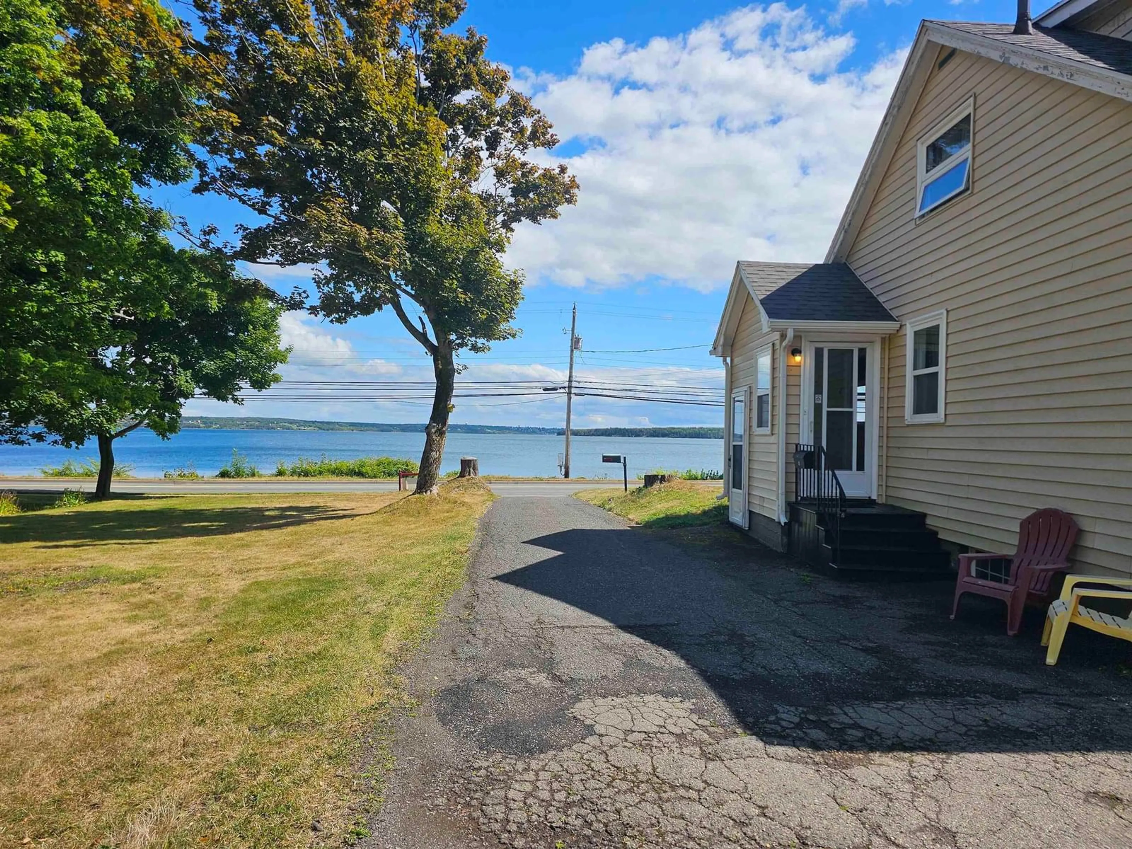A pic from outside/outdoor area/front of a property/back of a property/a pic from drone, water/lake/river/ocean view for 92 Queen St, North Sydney Nova Scotia B2A 1A6