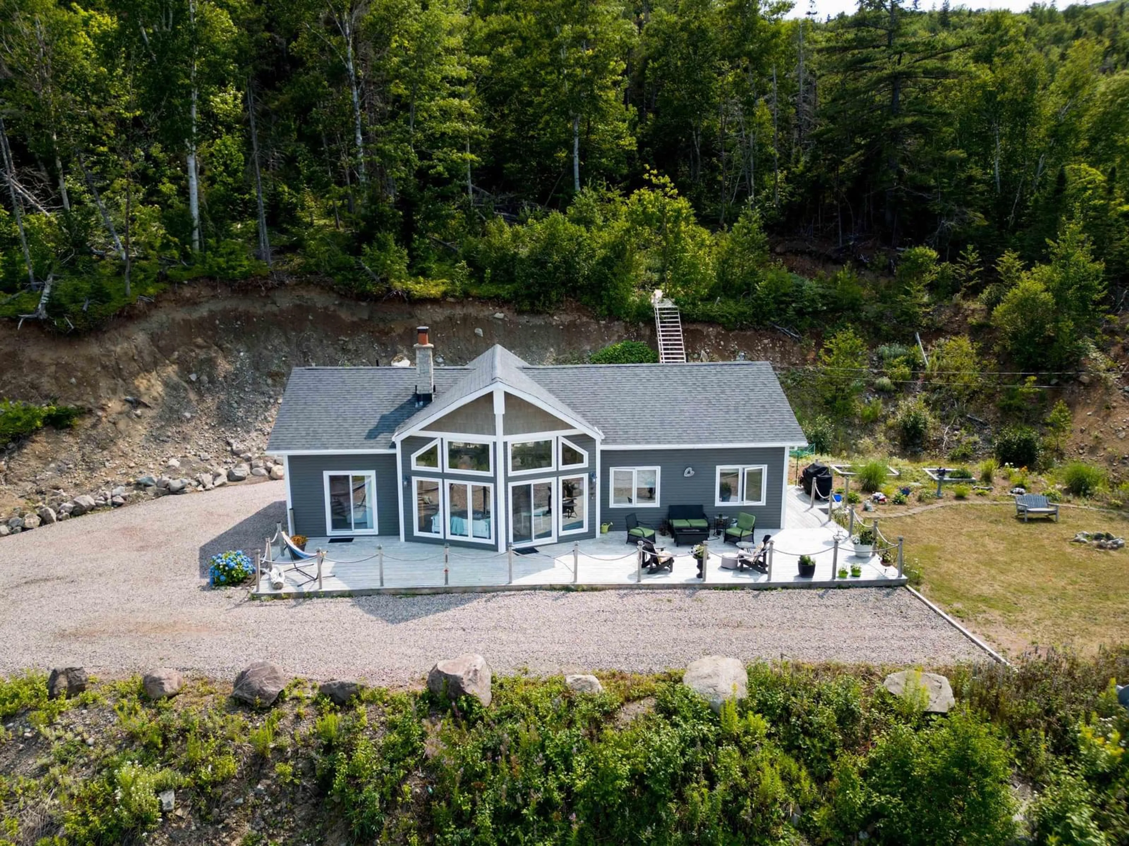 A pic from outside/outdoor area/front of a property/back of a property/a pic from drone, water/lake/river/ocean view for 39132 Cabot Trail, Ingonish Ferry Nova Scotia B0C 1L0