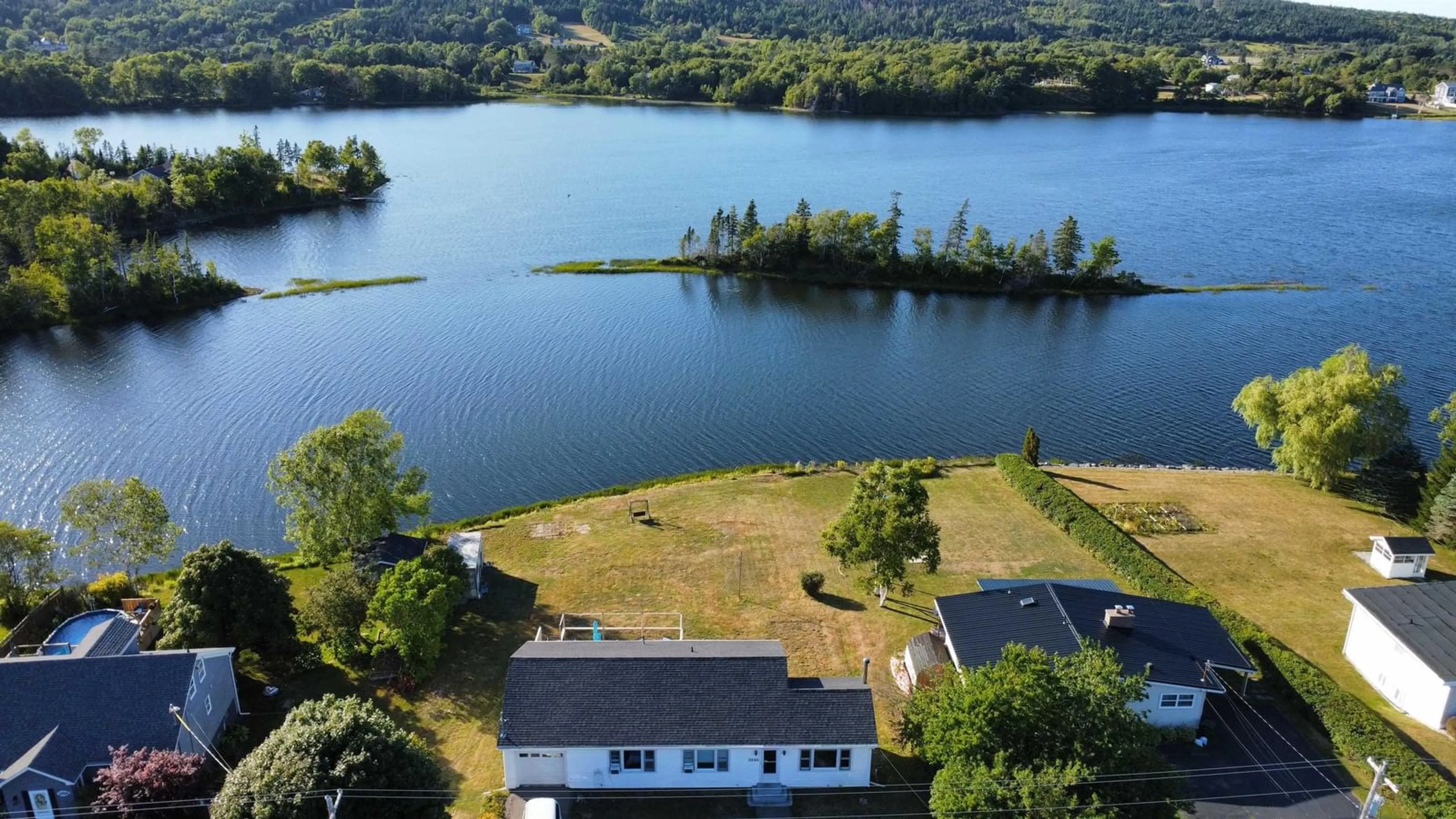 A pic from outside/outdoor area/front of a property/back of a property/a pic from drone, water/lake/river/ocean view for 2046 Kings Rd, Howie Centre Nova Scotia B1L 1C4